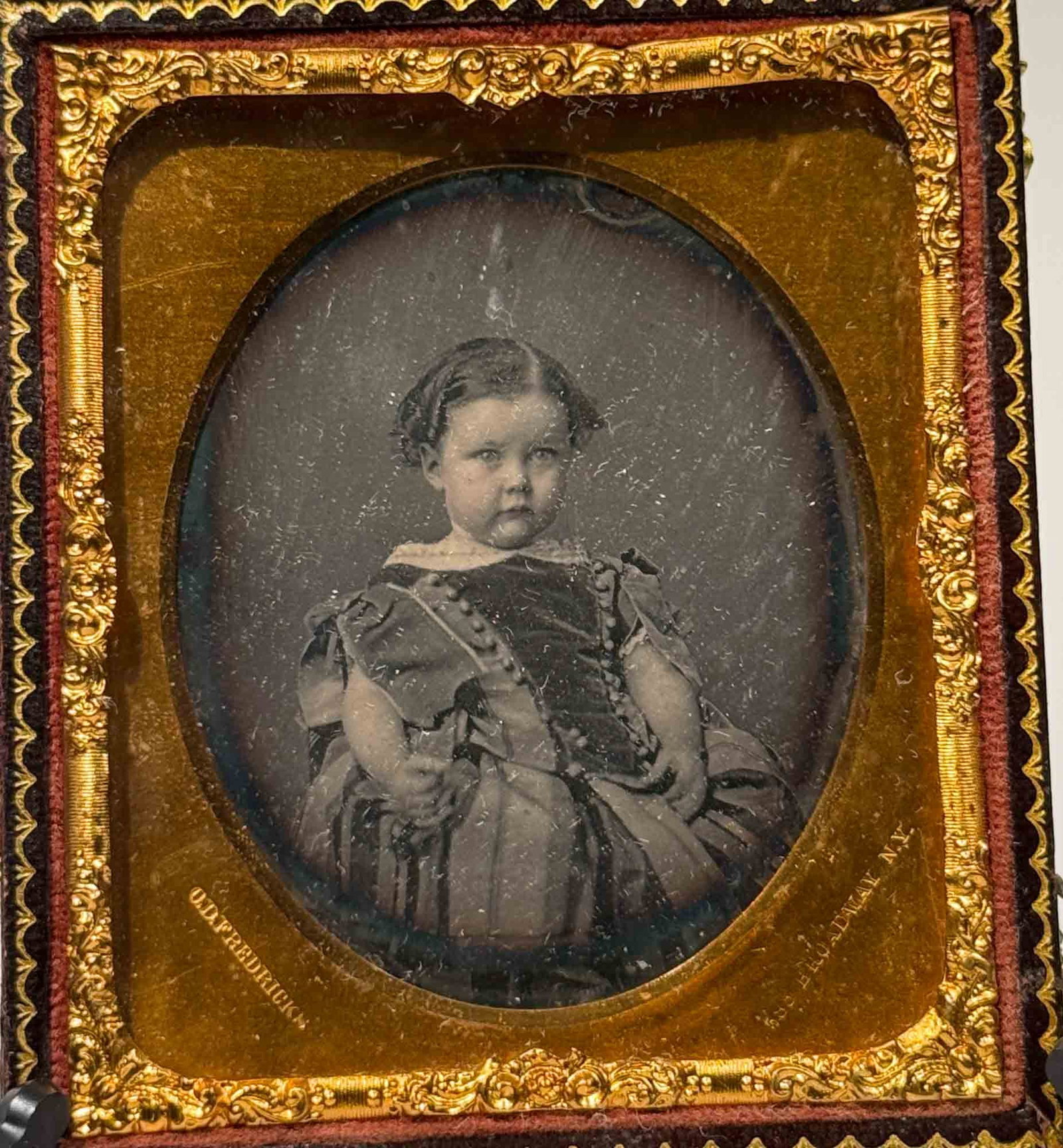 Daguerreotype, Unidentified Child, O.D. Fredericks, 588 Broadway NY: A sixth-plate daguerreotype portrait of an unidentified young child, produced at the Broadway studio of Charles DeForest Fredericks in New York City, most likely during the 1857 to 1858 period when he