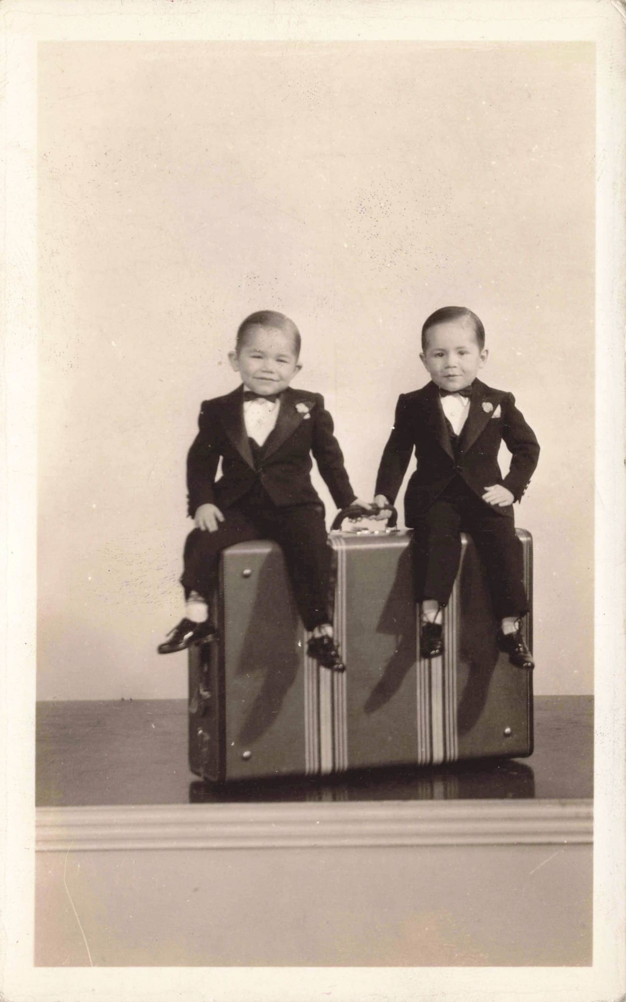 Real Photo Postcard, Two Little People in Tuxedos Seated on Suitcase (1 of 2)