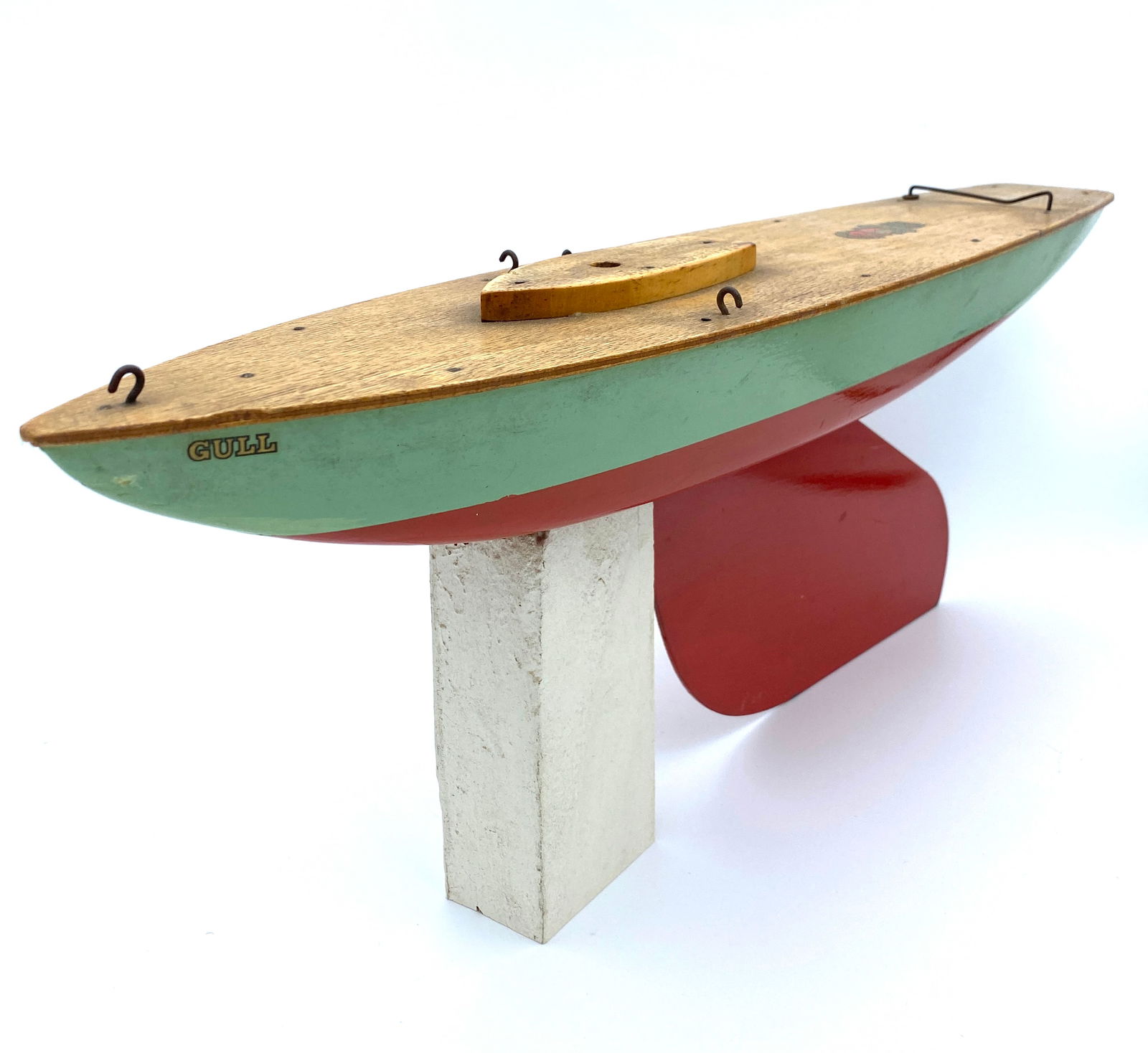 Vintage 1950s Gull Racing Yacht by Bowman of Norfolk, England, c 1950s: Vintage 1950s Gull Racing Yacht by Bowman of Norfolk, EnglandWooden hull painted sea foam green with red detailing. Metal keel.Missing mast, sails and stand.Hull & Keel dimensions: 18" Length, 7" Tall