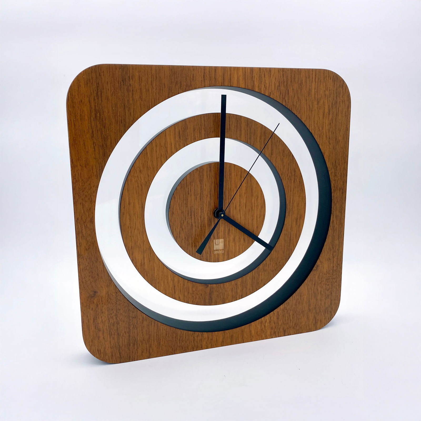 Umbra Echo Modern Wall Clock: Umbra Echo Modern Wall or Desk Clock, requires one AA battery for operation. 12" x 12" x 1.25", 24 oz