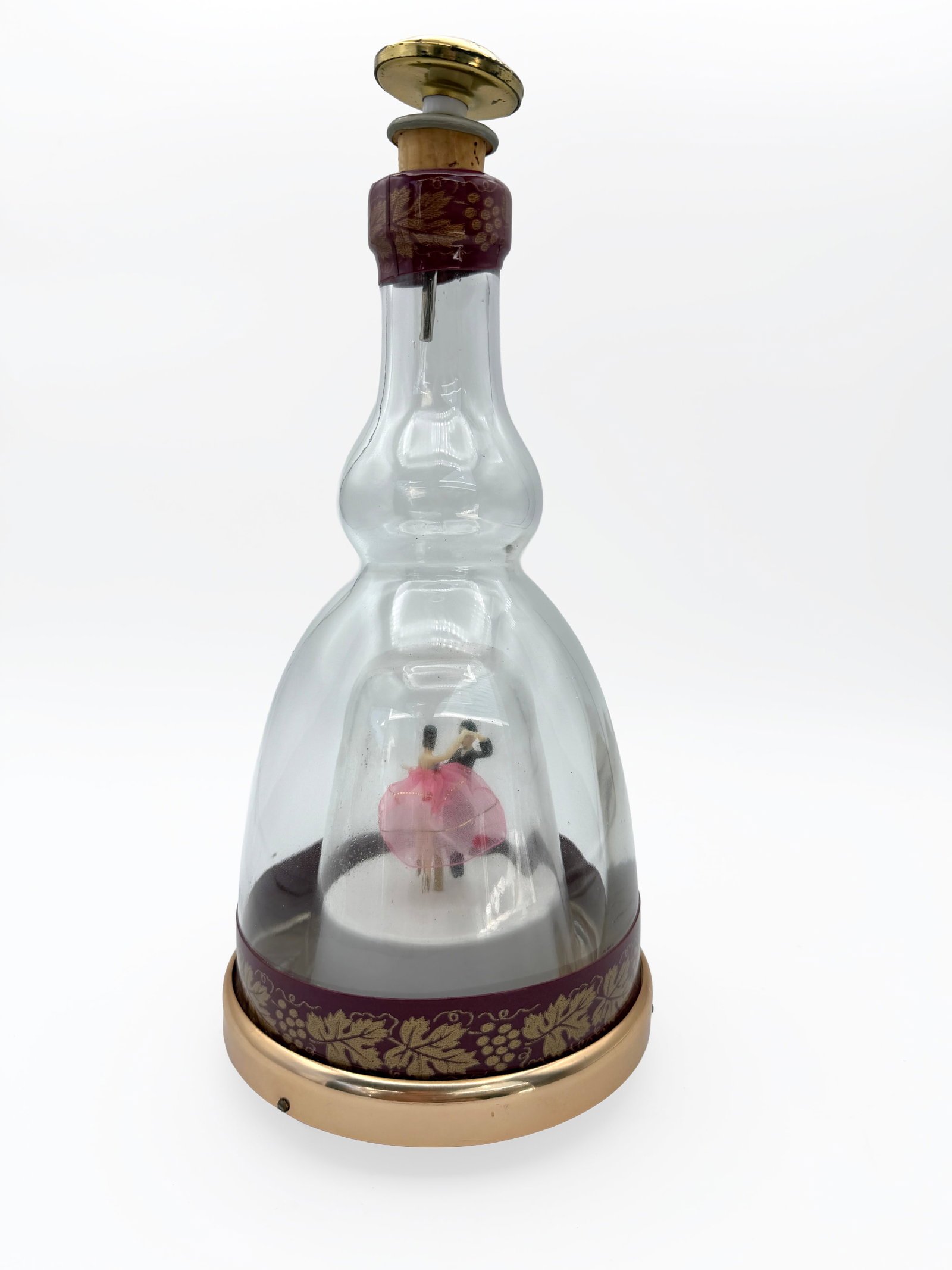 Vintage Wind Up Musical Decanter w/ Dancers: Vintage Japanese musical liquor decanter featuring a miniature dancing couple enclosed beneath an internal glass dome. When the mechanism is wound, the music plays and the couple rotates and dances.Th