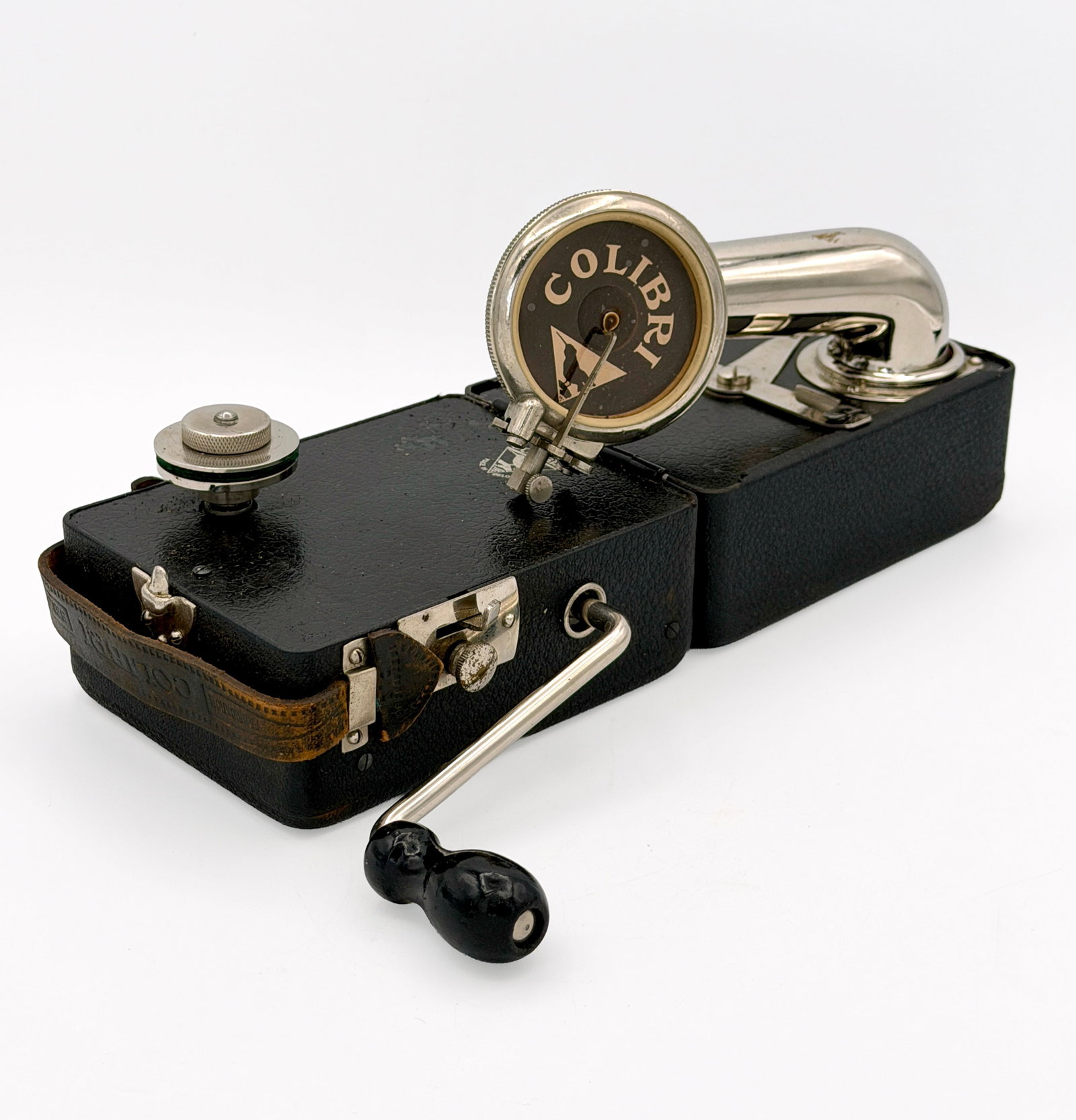 1930s Colibri Pocket Gramophone w/ Case: A portable gramophone by Colibri. Ca. 1930s. The Colibri was the smallest portable gramophones made in the first decades of the 20th centuries. It was produced in Belgium and mounted Swiss-made motor 