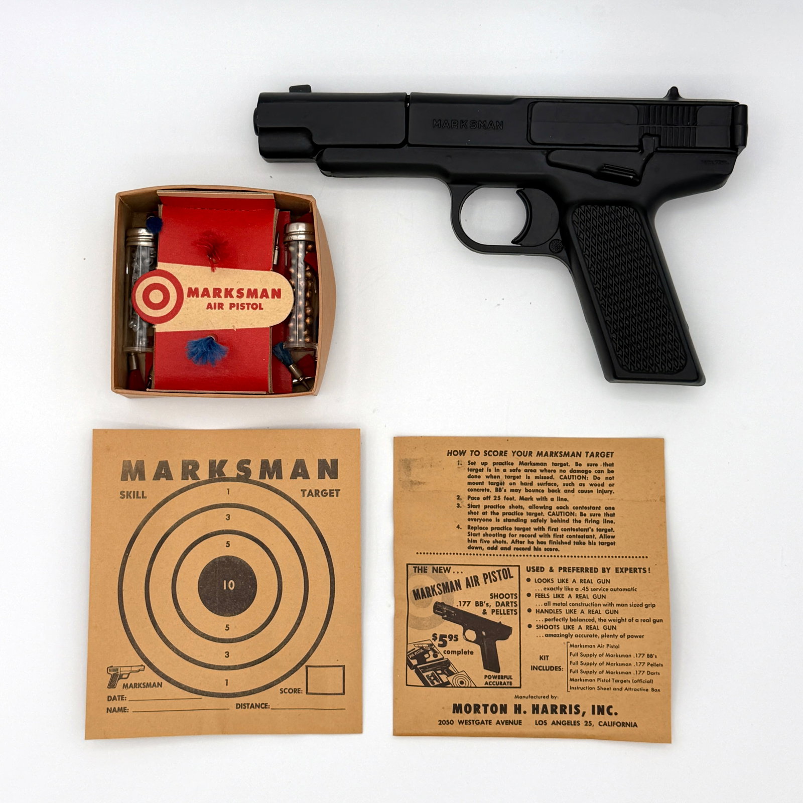 Vintage Marksman Air Pistol NIB: Vintage never used Marksman air pistol in original box and operating instructions. Shoots .177 BB's, darts and pellets. Crosman Super Pells and Marksman target included. Manufactured by Morton H.