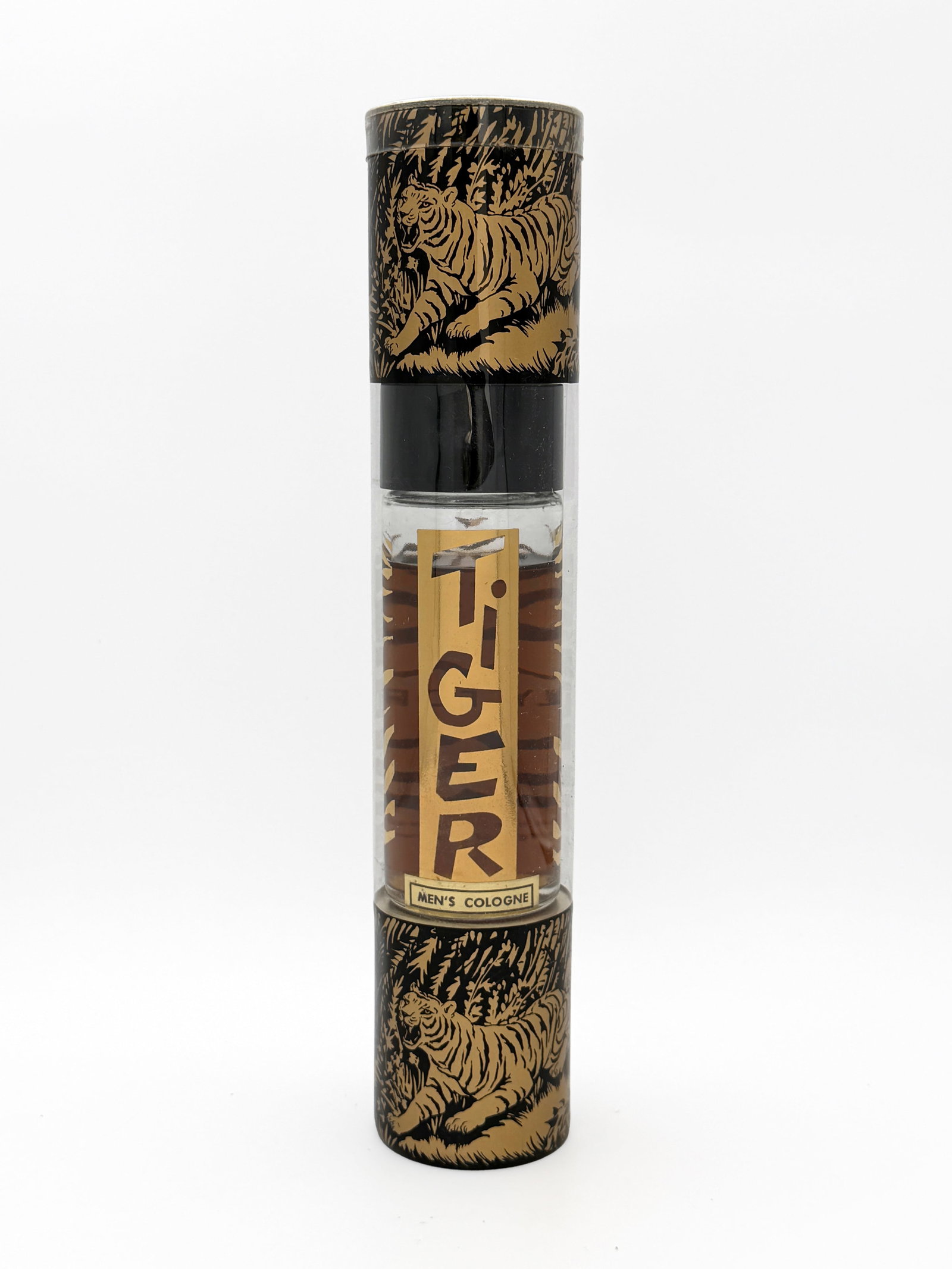 Vintage "Tiger" Men's Cologne 1960s MCM: Vintage Bergél of Hollywood “Tiger” Men’s Cologne in mid-century jungle and tiger-print packaging, circa 1960s. 4 fl. oz. bottle, unused and housed in its original cylindrical plastic prese