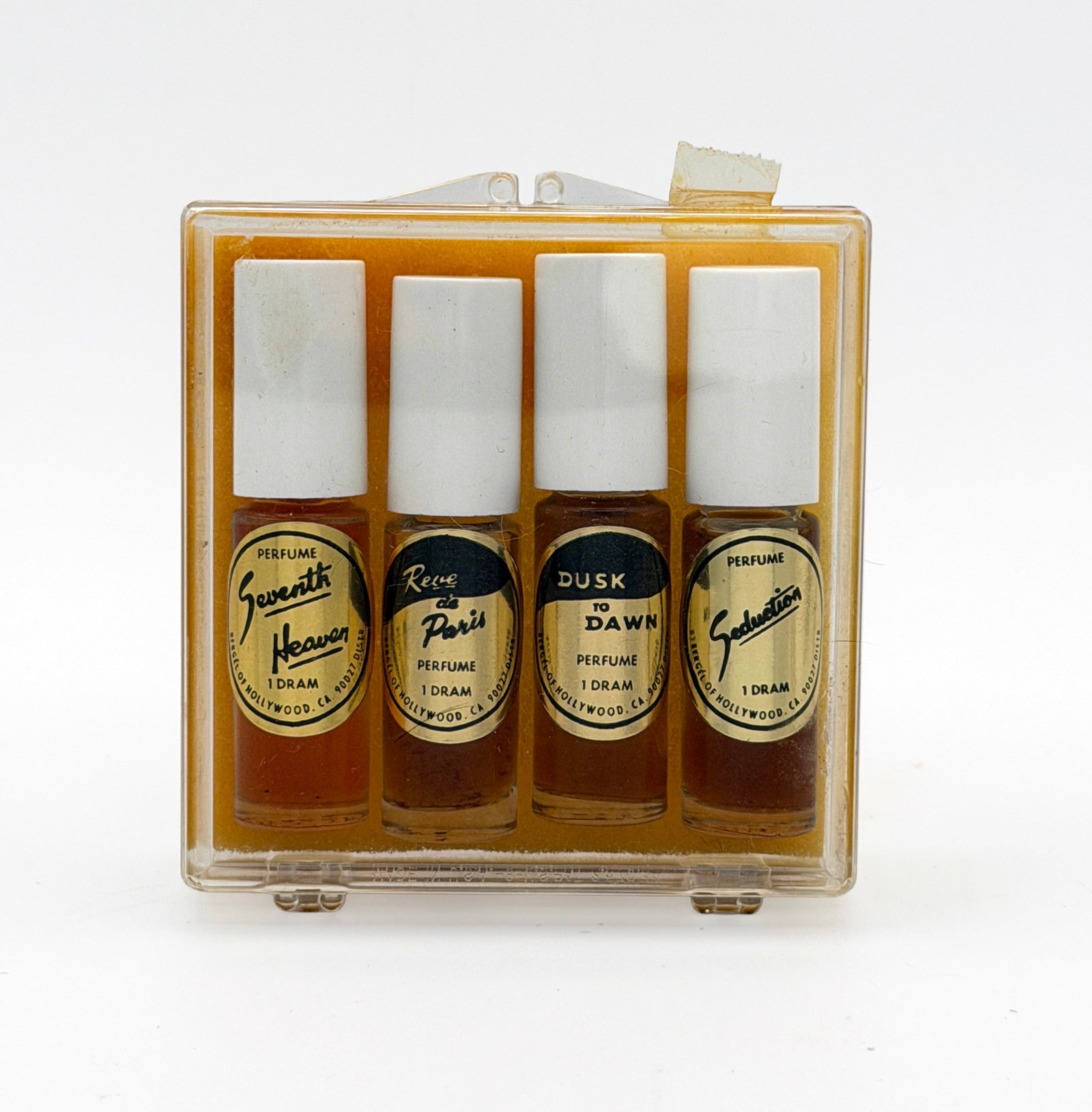 Vintage Rare set of 4 Mini perfumes: Vintage MCM Mini travel perfume bottle set of 4 - Seventh Heaven, Dusk to Dawn, Reve de Paris, & Seduction by Bergel of Hollywood (1.5 drams each bottle).