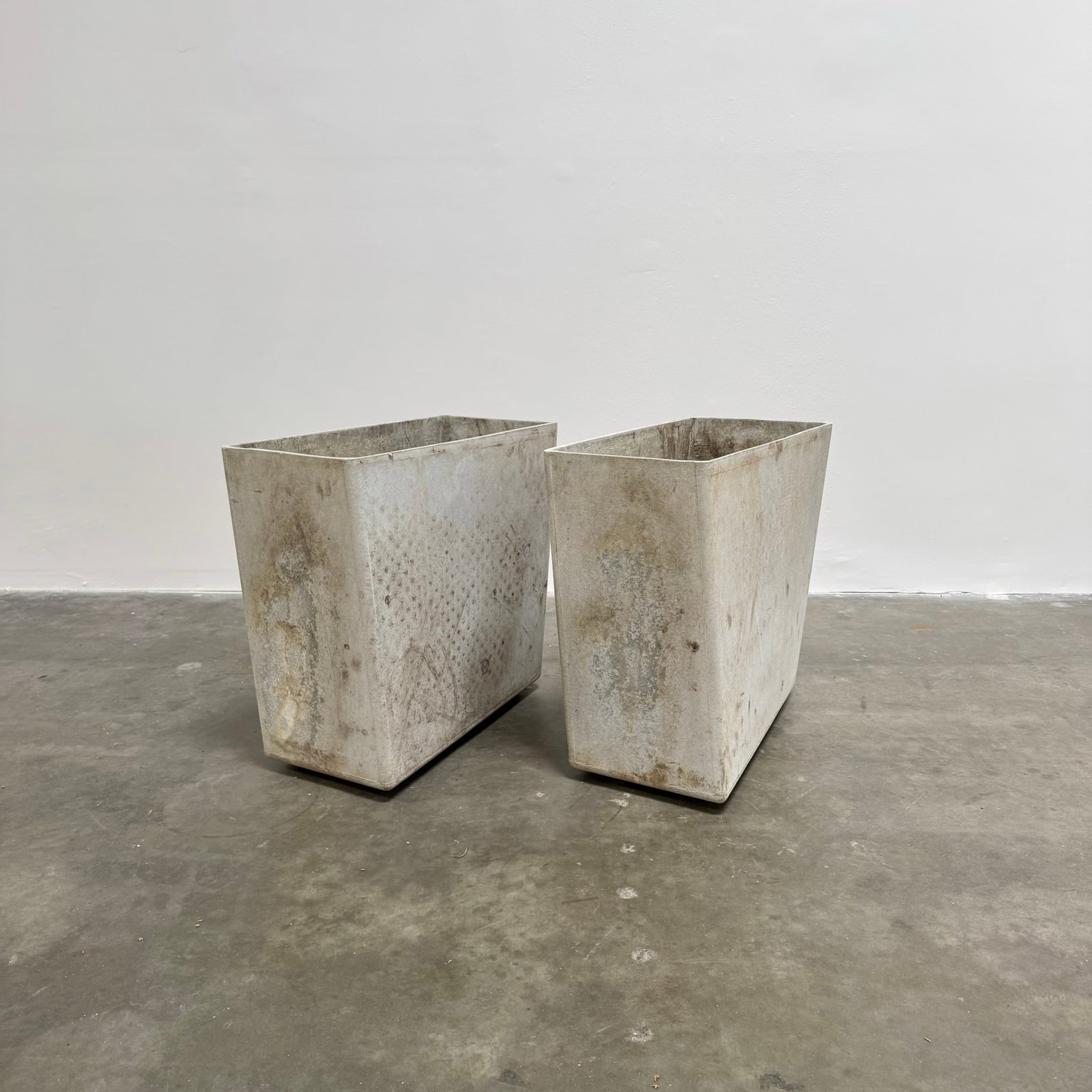 Pair of Willy Guhl Contorted Planters, Switzerland circa 1970: Uniquely designed Willy Guhl rhombus-shaped planters. Height: 23.5" Depth: 23.5" Width: 12"