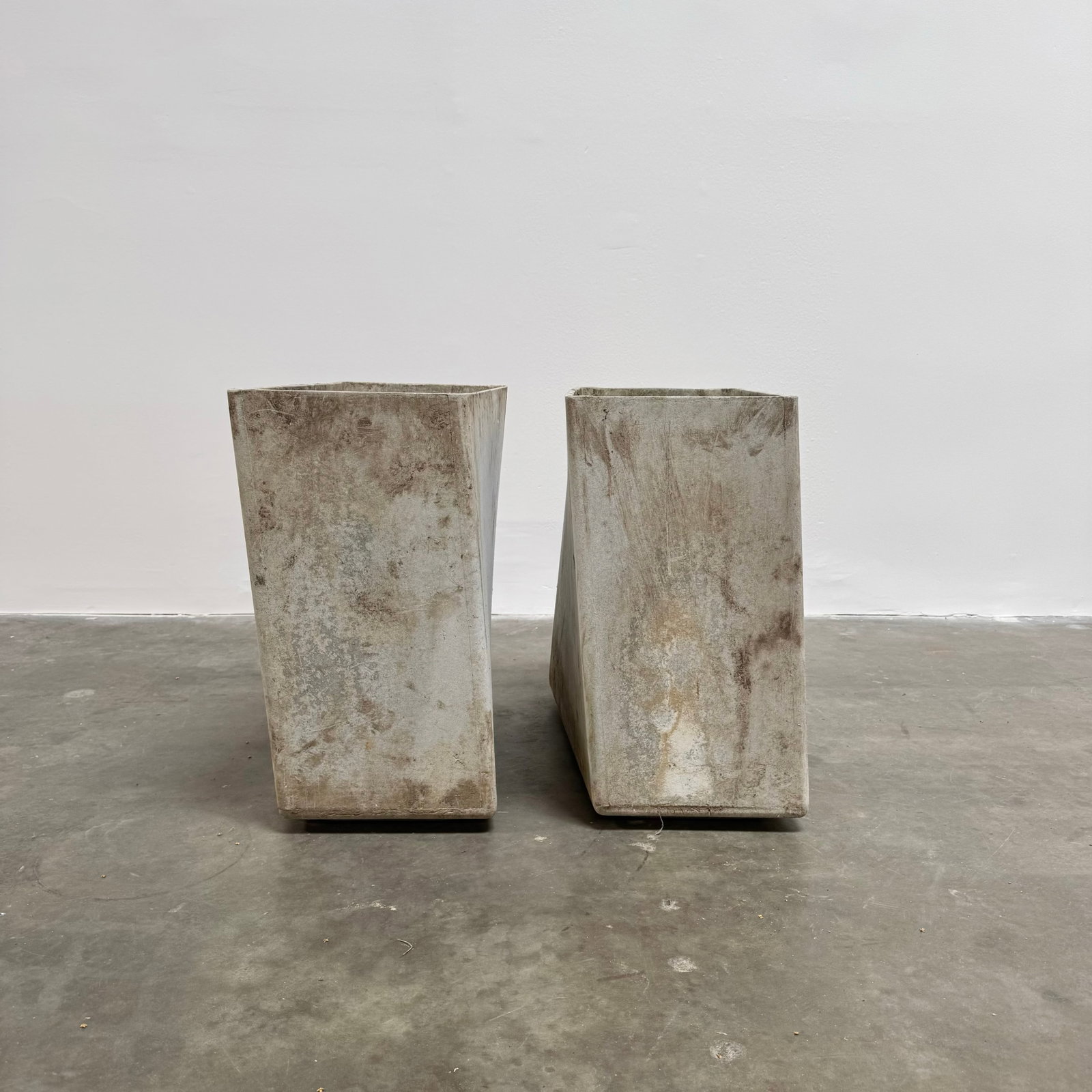 Pair of Willy Guhl Contorted Planters, Switzerland circa 1970: Uniquely designed Willy Guhl rhombus-shaped planters. Height: 23.5" Depth: 23.5" Width: 12"