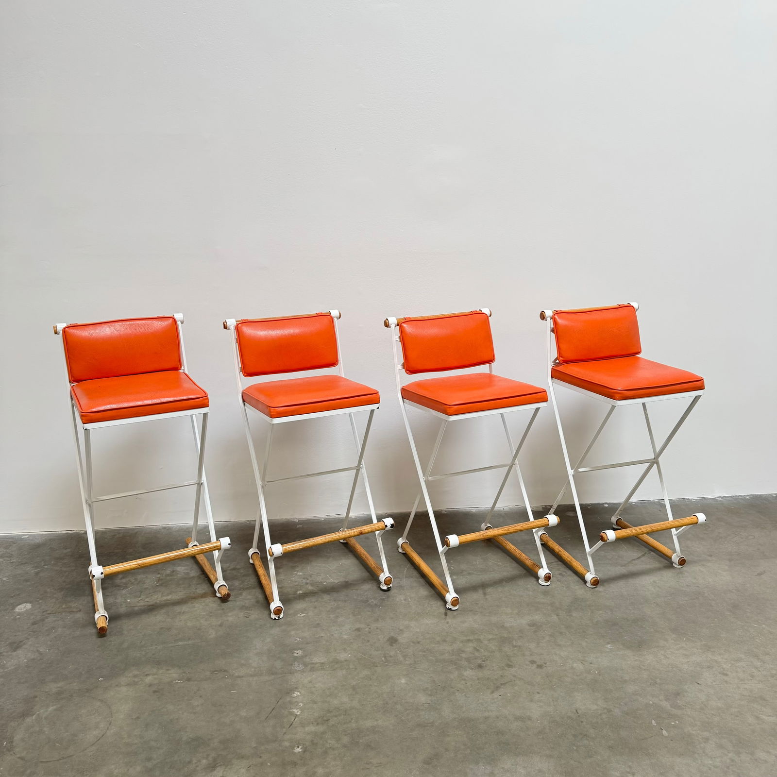 Cleo Baldon Orange Bar Stools, USA Circa 1965: Set of 4 Cleo Baldon bar/counter stools in original orange pleather fabric. Height: 39.5" Width: 18" Depth: 18" Seat Height: 32"