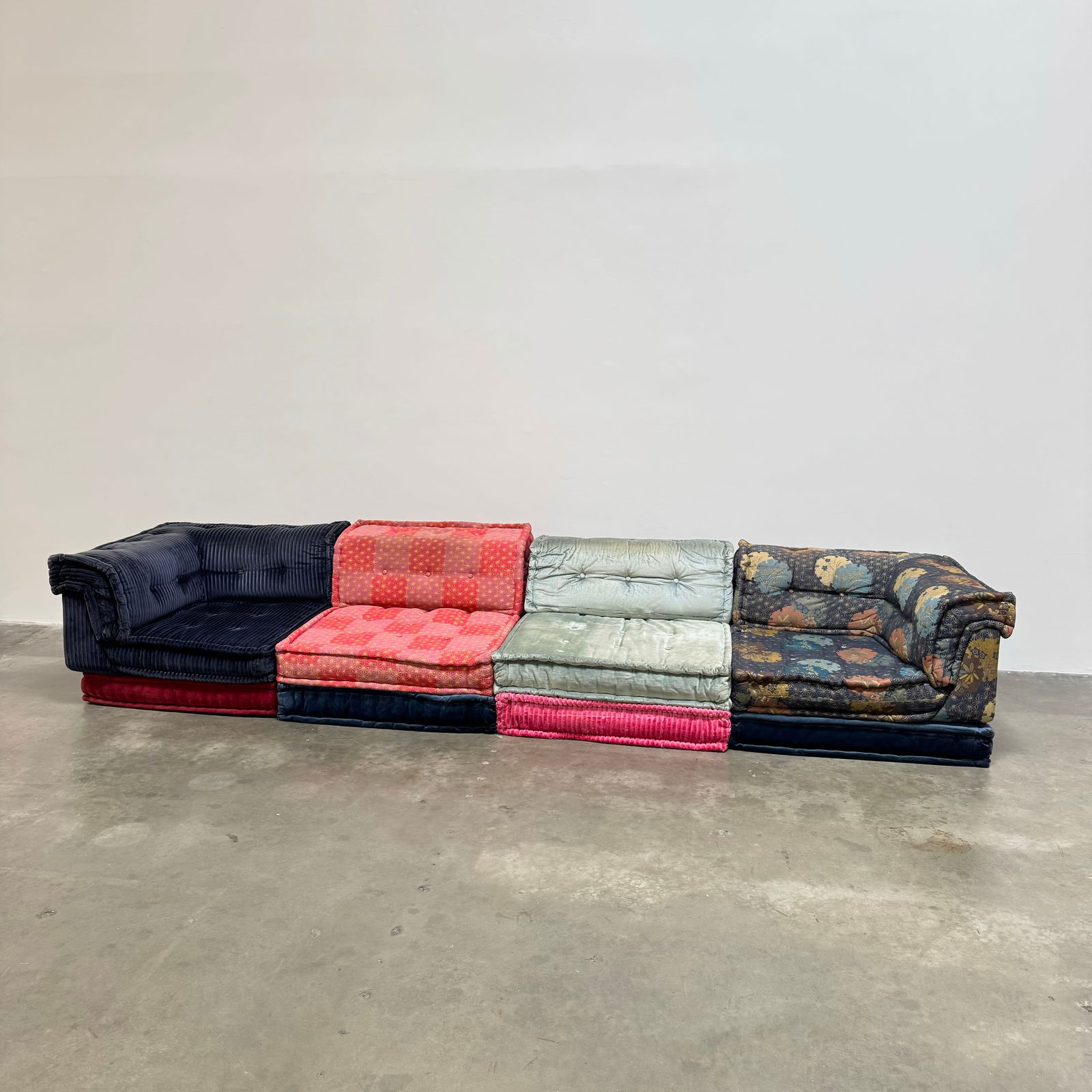 12-Piece Mah Jong Sofa in Kenzo and Missoni Fabric by Roche Bobois, France circa 2010: Beautiful 12-piece Mah Jong sofa manufactured by Roche Bobois in Kenzo and Missoni fabric. Individual dimensions: Floor Pillows: Height: 7" Width: 37.5" Depth x 37.5" Corner: Height: 20.5" Width: 37.5