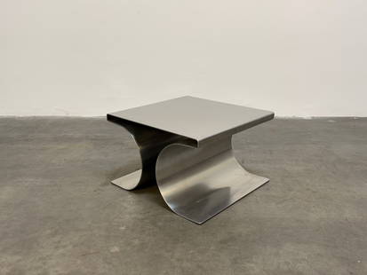 Model X Stainless Steel Stool by Michel Boyer, 1968: A sleek and sculptural Model X coffee table by Michel Boyer, crafted in brushed stainless steel. This rare piece exemplifies Boyer’s minimalist yet bold design language, featuring fluid, curved line