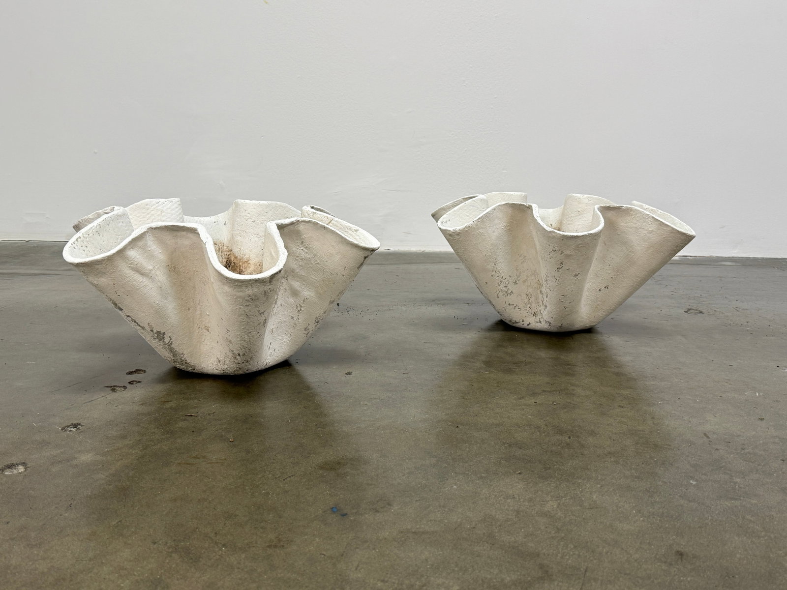 Pair of Small Clamshell Planters by Willy Guhl, Switzerland Circa 1960: Pair of small Clamshell planters by Willy Guhl for Eternit, Switzerland circa 1960. Factory-drilled drainage holes. Wonderful patina. Height: 10 in. Width: 20 in. Depth: 20 in.