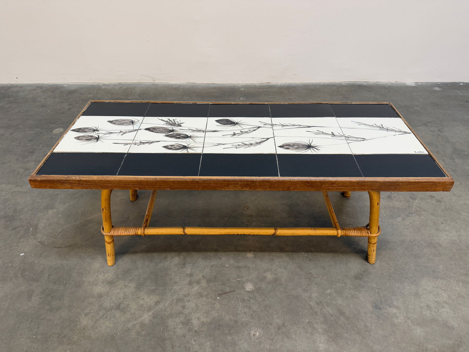 Audoux Minet and Roger Capron 1960s Bamboo Ceramic Tile Coffee Table: A stunning vintage coffee table designed by Roger Capron in collaboration with Audoux Minet, featuring a beautifully hand-painted ceramic tile top. The table showcases Capron's signature botanical mot