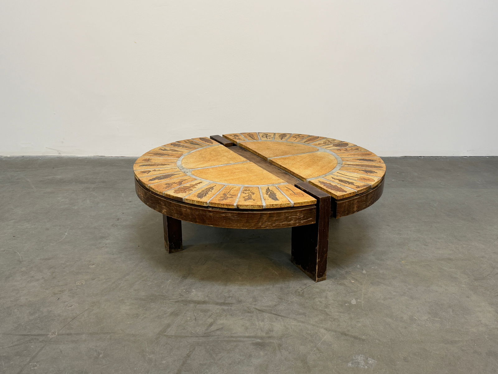 Oval Ceramic Split Coffee Table by Roger Capron: A striking oval-shaped ceramic coffee table by Roger Capron, featuring a unique split design with beautifully textured tiles. Height: 13 in. Width: 41 in. Depth: 28 in.