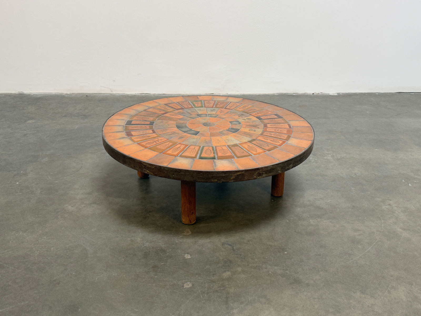 Roger Capron Garrigue Coffee Table with Metal Frame: Roger Capron coffee table featuring Garrigue tiles, a technique in which real leaves from La Garrigue, a variety of vegetation indigenous to southeastern France only, are pressed into the clay and, du