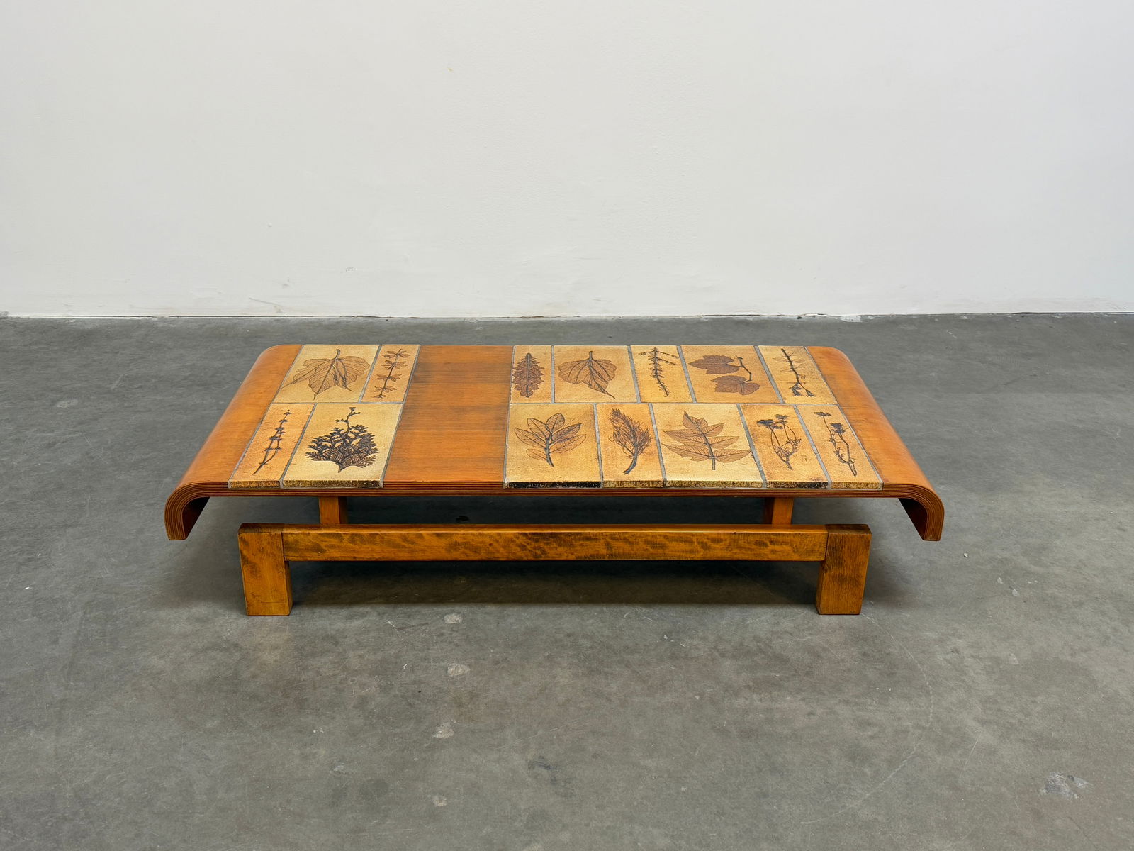 Capron Herbarium Pine Wood Coffee Table: Roger Capron coffee table featuring Garrigue tiles - a technique in which real leaves from La Garrigue, a variety of vegetation indigenous to southeastern France only, are pressed into the clay and, d