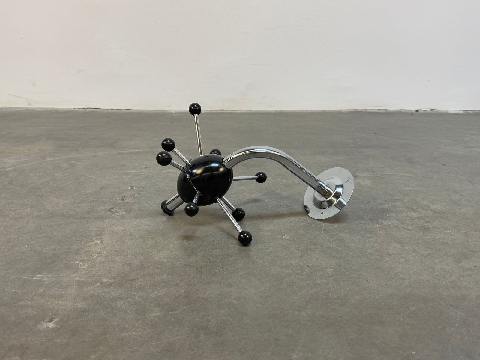 Osvaldo Borsani Special Edition Sputnik Coat Rack: A rare special edition Sputnik coat rack by Osvaldo Borsani, showcasing a futuristic design with a chrome structure and spherical accents. A true collector's piece. Height: 14 in. Width: 10 in.