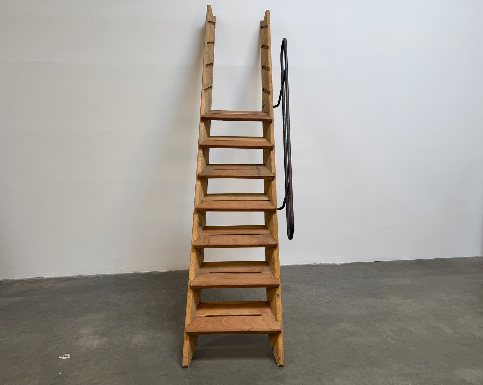 Cite Radieuse Staircase by Le Corbusier: An original wooden staircase with a black metal handrail from the legendary architect Le Corbusier's Cité Radieuse housing unit. A rare architectural element embodying the raw and functional beauty o