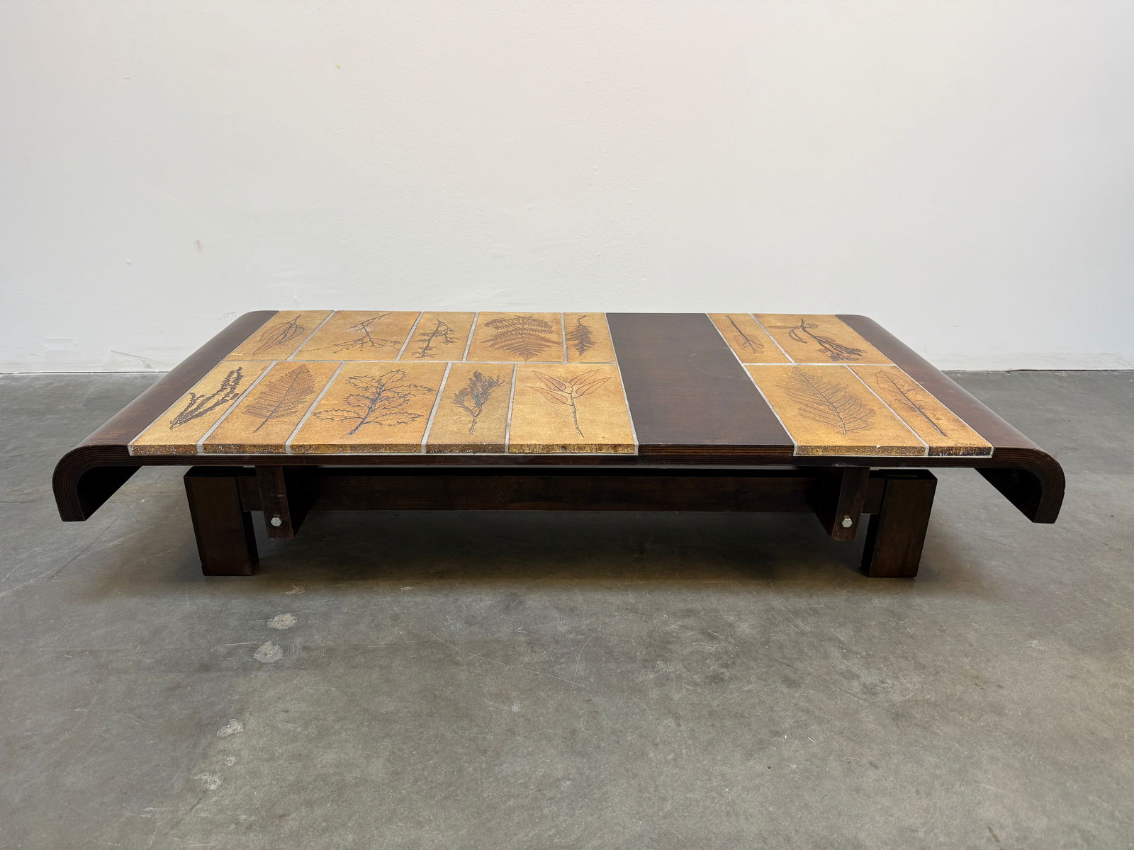 Capron Herbarium Wood Coffee Table: Roger Capron coffee table featuring Garrigue tiles, a technique in which real leaves from La Garrigue, a variety of vegetation indigenous to southeastern France only, are pressed into the clay and, du