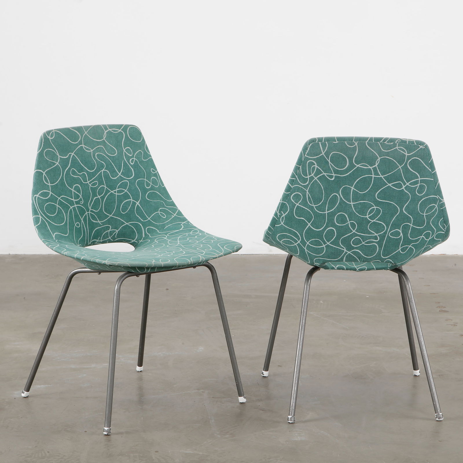 Pair of Mid-Century Chairs by Augusto Bozzi, 1950s: These striking Italian-designed chairs by Augusto Bozzi feature steel legs and a teal and white fabric seat, a timeless product, 1950s. Height: 31 in. Width: 20 in. Depth: 14 in. Seat Height: 18 In.