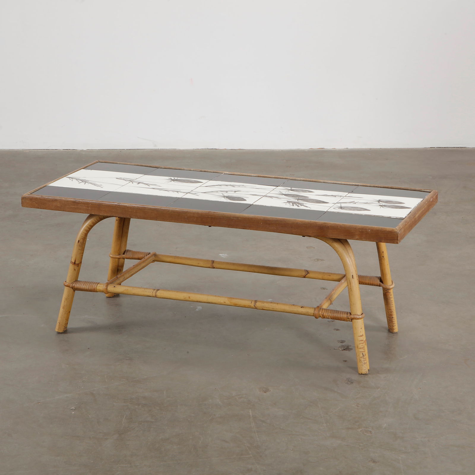 Audoux Minet & Roger Capron 1960s Bamboo Ceramic Tile Top Coffee Table: A stunning vintage coffee table designed by Roger Capron in collaboration with Audoux Minet, featuring a beautifully hand-painted ceramic tile top. The table showcases Capron signature botanical motif