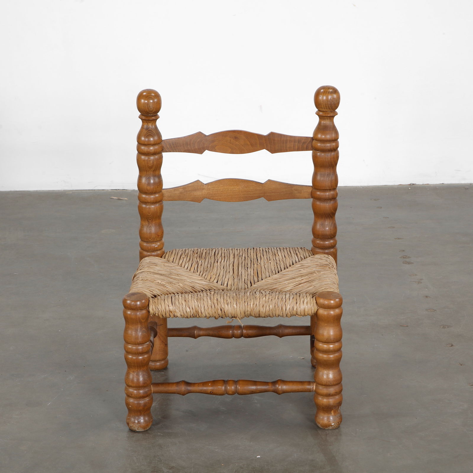 Brutalist Wood and Wicker Chair by Charles Dudouyt, 1930s: Small wood and wicker chair by Charles Dudouyt. Structure in bulrush wood and wicker seat. Height: 29 in. Width: 19 in. Depth: 17 in. Seat Height: 12 in.