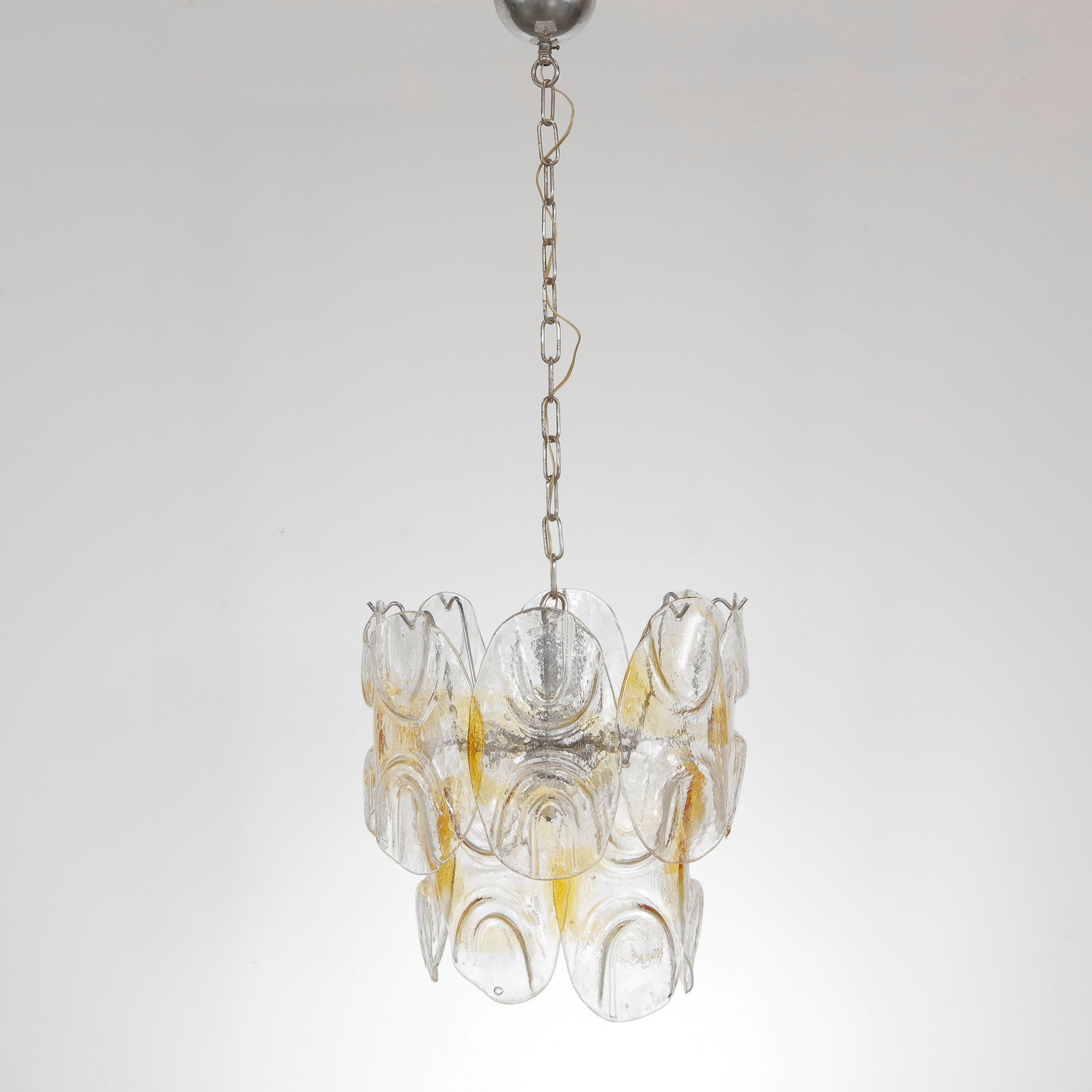 Murano Glass Chandelier, Italy, 1960s: A stunning Murano glass chandelier featuring hand blown glass elements in a sculptural arrangement, 1960s. Height: 43 in. Width: 15 in.