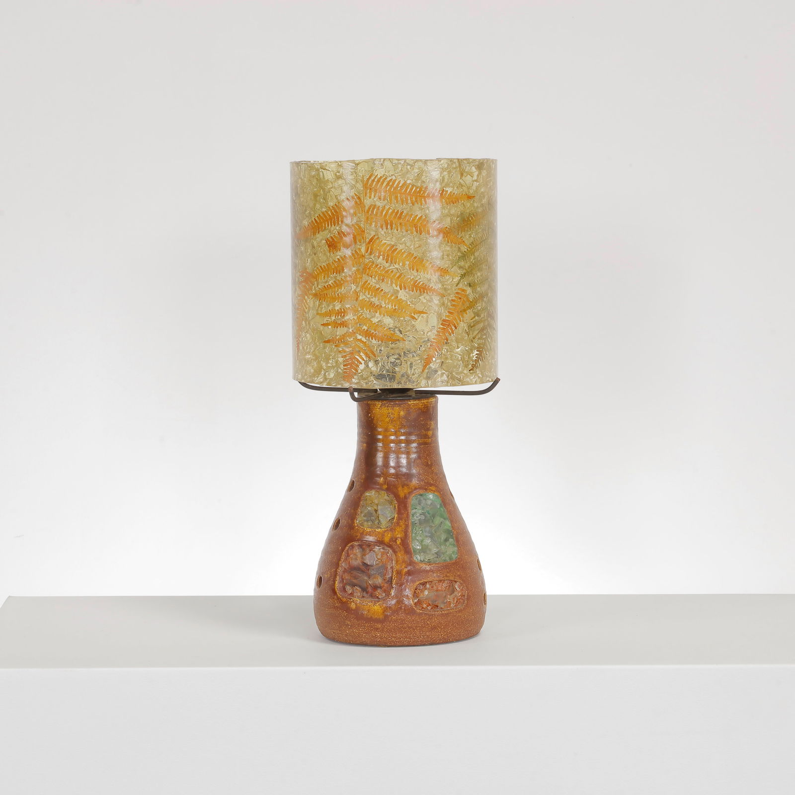 Accolay Ceramic Lamp with Resin Lampshade, France, 1970s: Unique ceramic table lamp by Accolay, featuring a textured base with colored glass inserts and a translucent resin shade embedded with ferns. A striking example of 1970s French design. Height: 17 in.