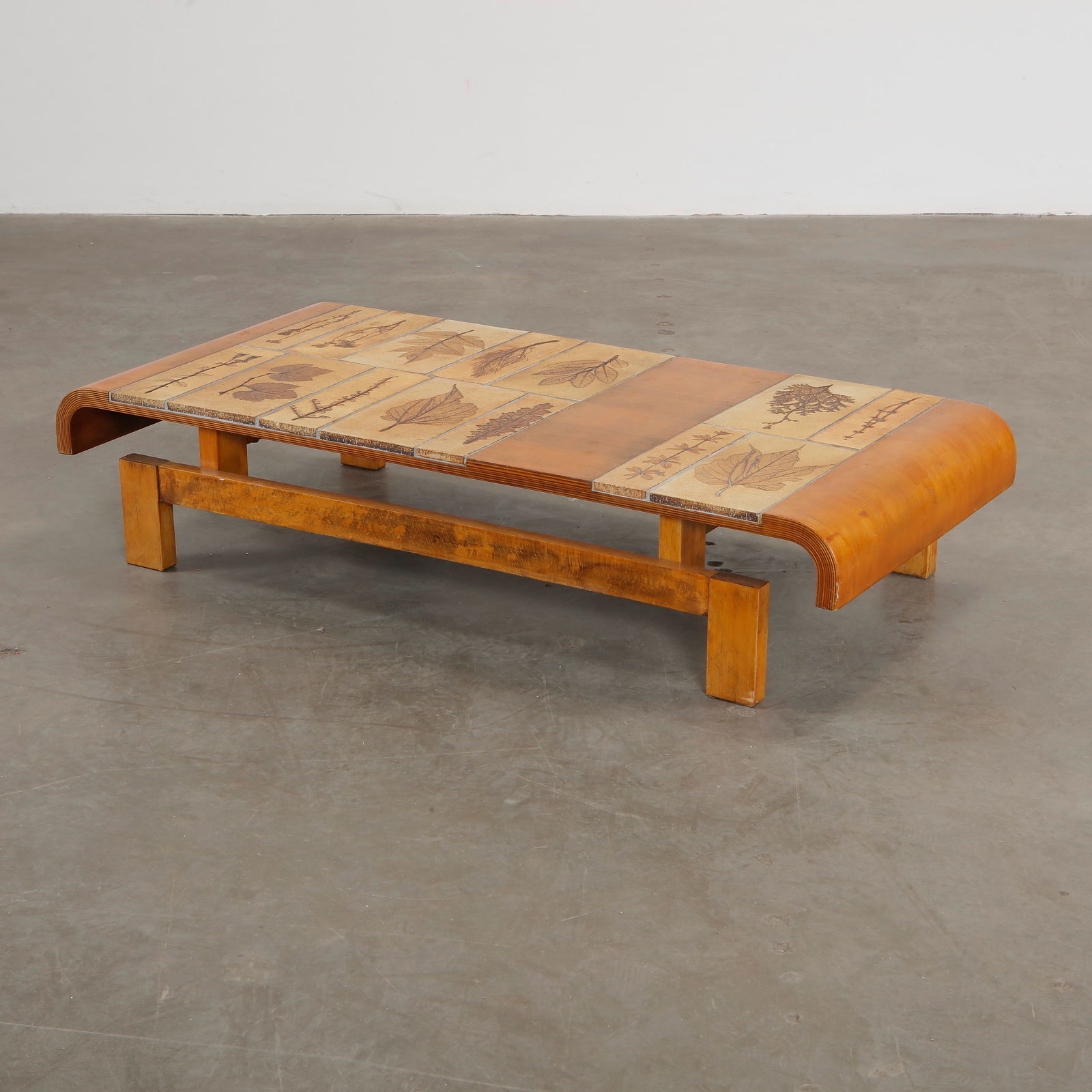 Roger Capron Herbarium Pine Wood Coffee Table, 1960s: Roger Capron coffee table featuring Garrigue tiles, a technique in which real leaves from La Garrigue, a variety of vegetation indigenous to southeastern France only, are pressed into the clay and, du