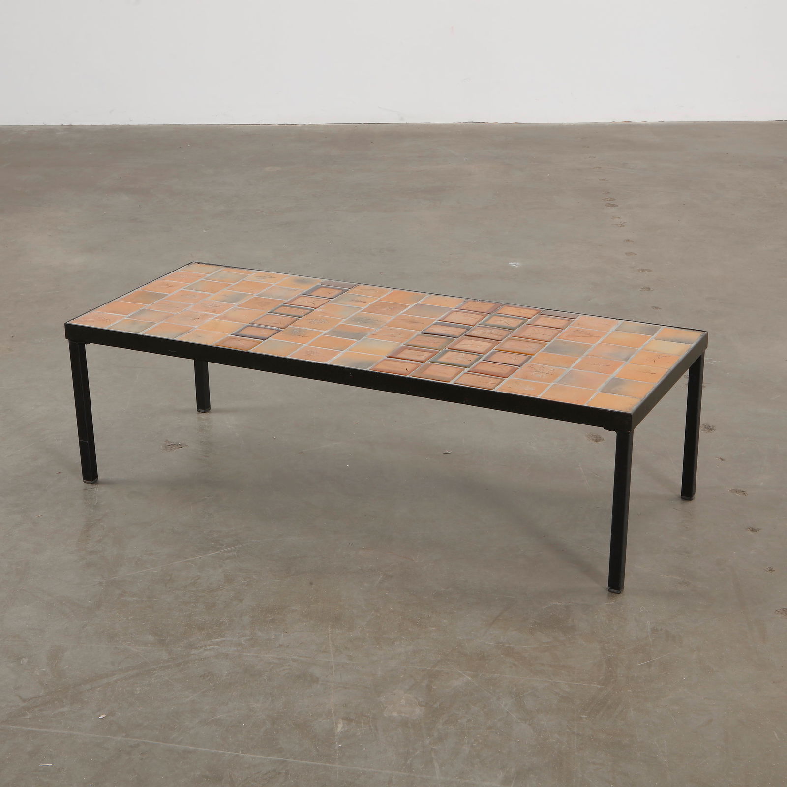 Roger Capron Rectangular Ceramic Coffee Table, 1970s: Vintage rectangular coffee table by Roger Capron, showcasing his signature ceramic tile work with intricate natural motifs. Height: 12 in. Length: 40 in. Width: 16 in.