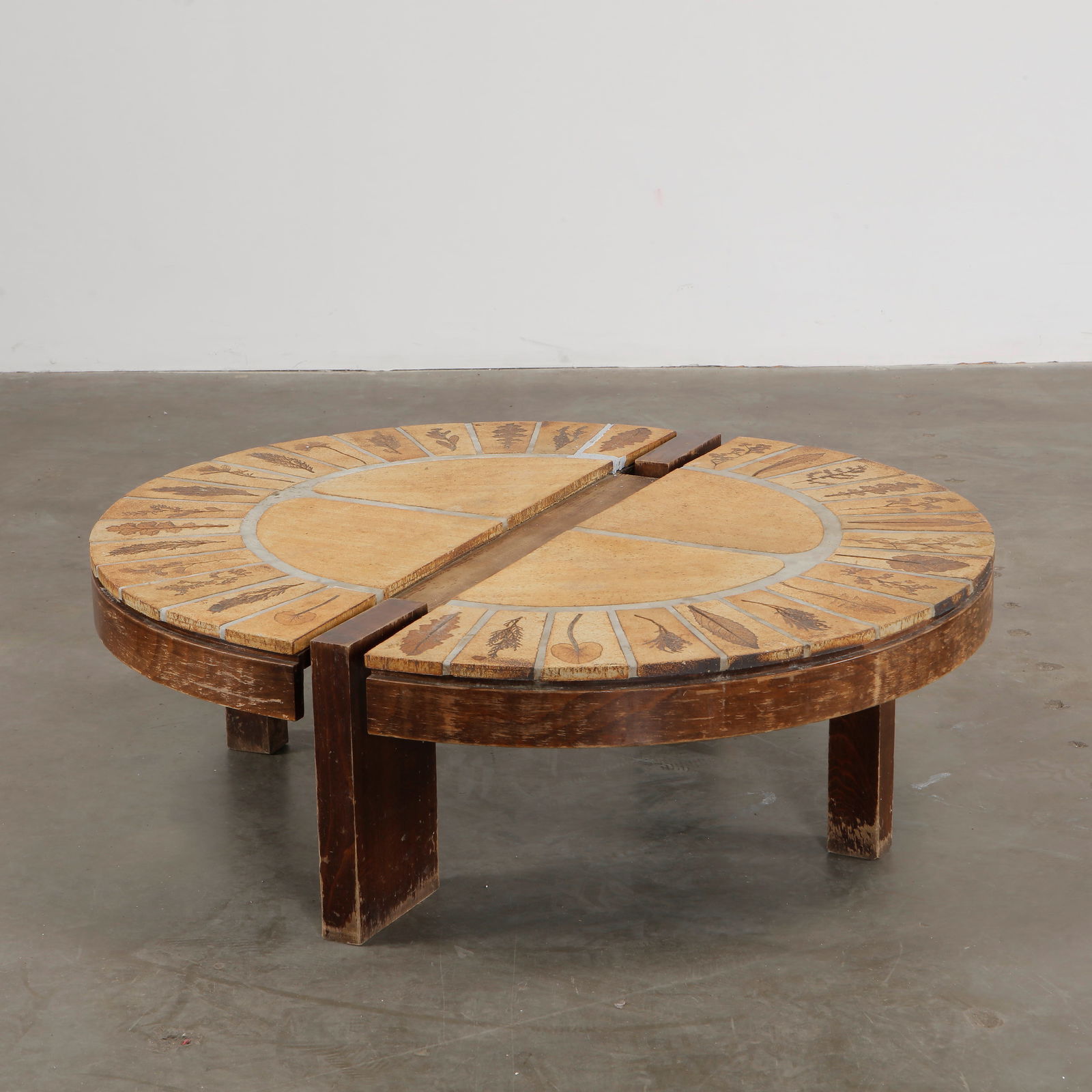 Oval Ceramic Split Coffee Table by Roger Capron, 1970s: A striking oval ceramic coffee table by Roger Capron, featuring a unique split design with beautifully textured tiles. Height: 13 in. Width: 37 in. Length: 41 in.