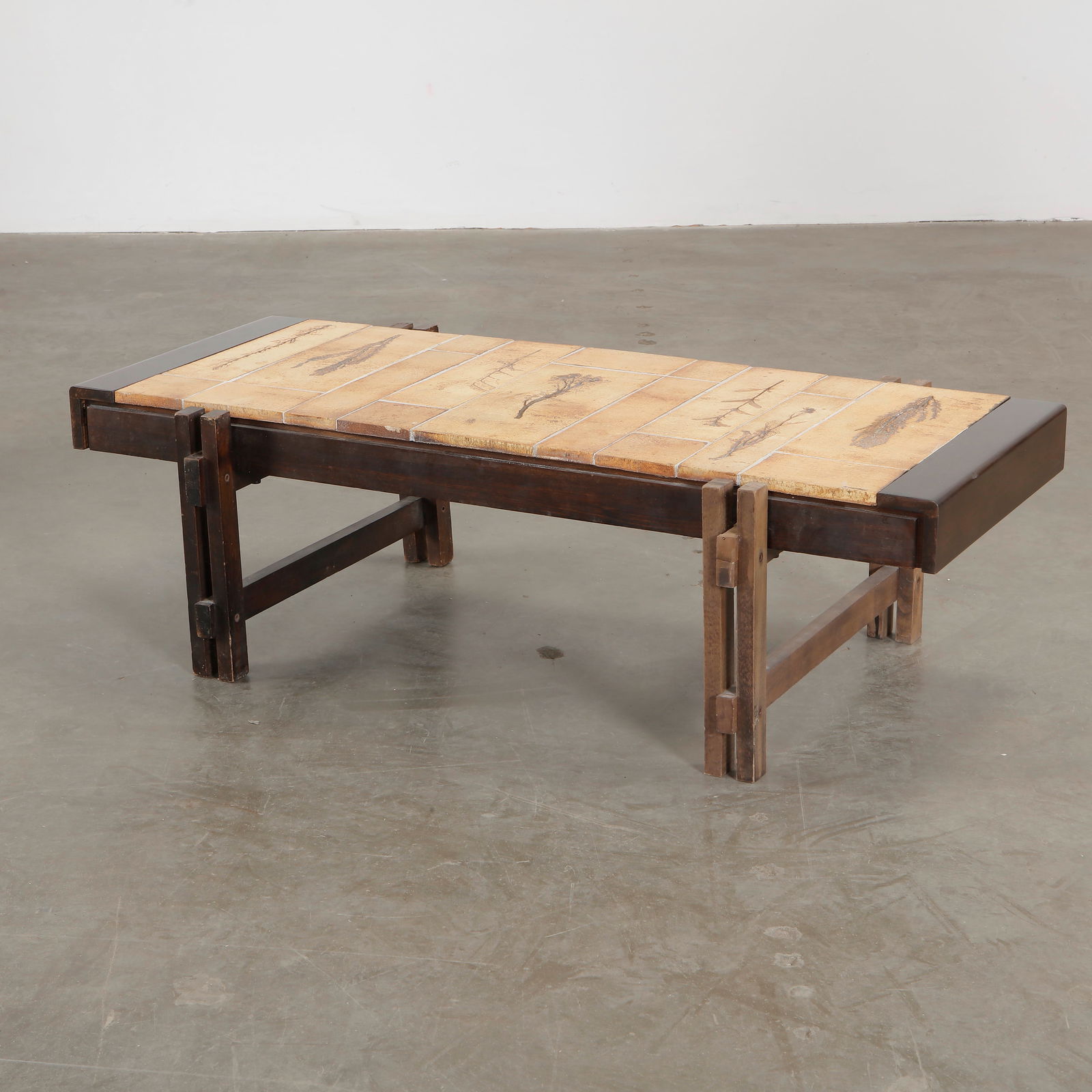 Roger Capron Herbarium Wood Coffee Table, 1960s: Roger Capron coffee table featuring Garrigue tiles, a technique in which real leaves from La Garrigue, a variety of vegetation indigenous to southeastern France only, are pressed into the clay and, du