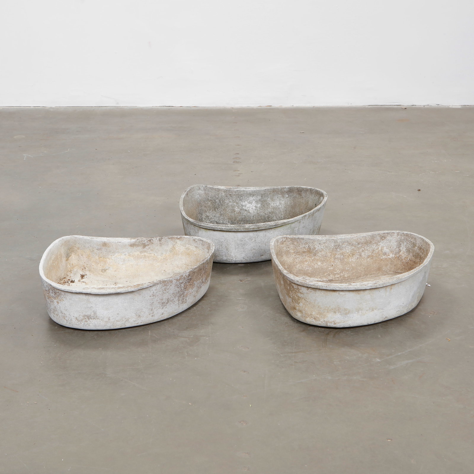 Trio of Willy Guhl Freeform Planters, 1960s: These organically contoured vessels exemplify Willy Guhl sculptural experimentation, each offering a unique form shaped by hand and time. Width: 19 in. Length: 15.5 in. Height: 5.5 in.