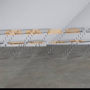 Giancarlo PIRETTI, Four Plia Folding Chairs in Chrome and Cane, c. 1967: An iconic innovation of Italian design, these four Plia chairs feature chromed tubular frames and caned seats, are emblematic of Piretti contribution to democratic design. Height: 29 in. Width: 18.5 i
