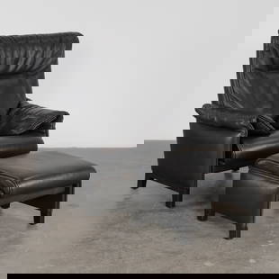 De Sede, Ds 49 Black Leather Armchair with Ottoman, 1970s: Luxurious high-back armchair with Ottoman in supple black leather from the DS-49 series by De Sede. Switzerland, 1970s. Armchair: Height: 32.28 in. Width: 31.50 in. Depth: 33.46 in. Height seat: 15.75
