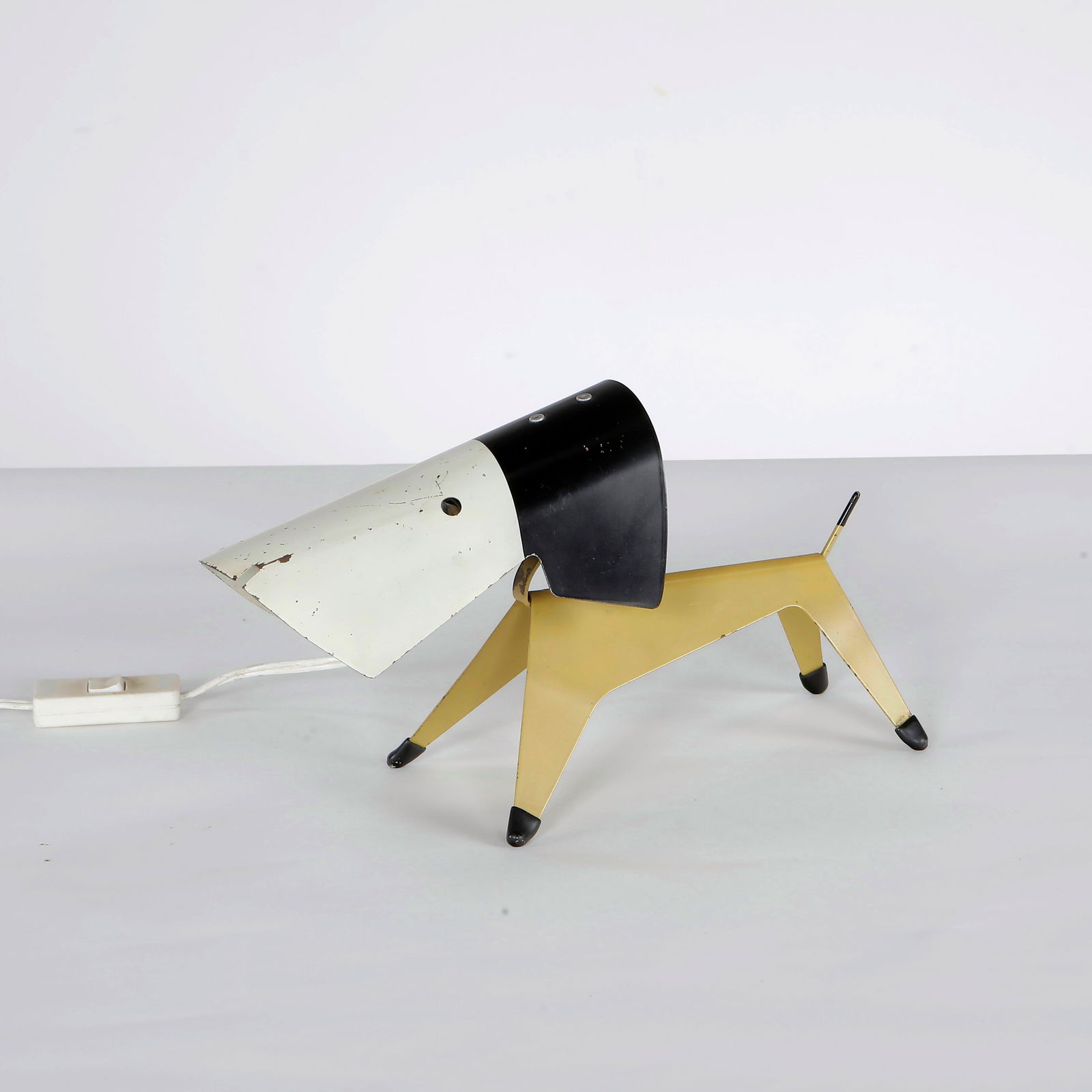Jean Boris Lacroix for Disderot, Dog Table Lamp, Metal, France, 1950s: A whimsical and rare table lamp designed by Jean Boris Lacroix for Disderot in the 1950s. This metal dog lamp is a fine example of mid-century French lighting design, balancing playful aesthetics with