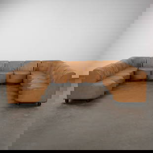 13-Piece Leather Modular Sofa Attributed to Tito Agnoli, 1980s: Striking 13-piece sectional attributed to Tito Agnoli, upholstered in camel leather with deep tufting and modular versatility. including 11 seats and 2 corner pieces. Each Piece: 30 in. Width: 32 in.