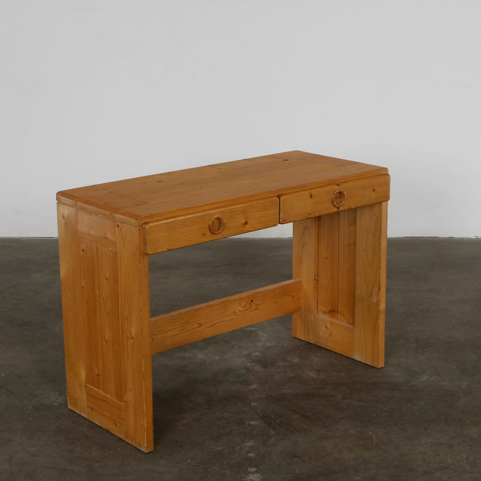Charlotte Perriand, Desk for Les Arcs 1600, 1960s: Pine desk with clean lines and integrated drawer pulls, designed by Perriand for the Les Arcs ski resort. An honest expression of material and proportion, ideal for modern alpine interiors. Height: 27