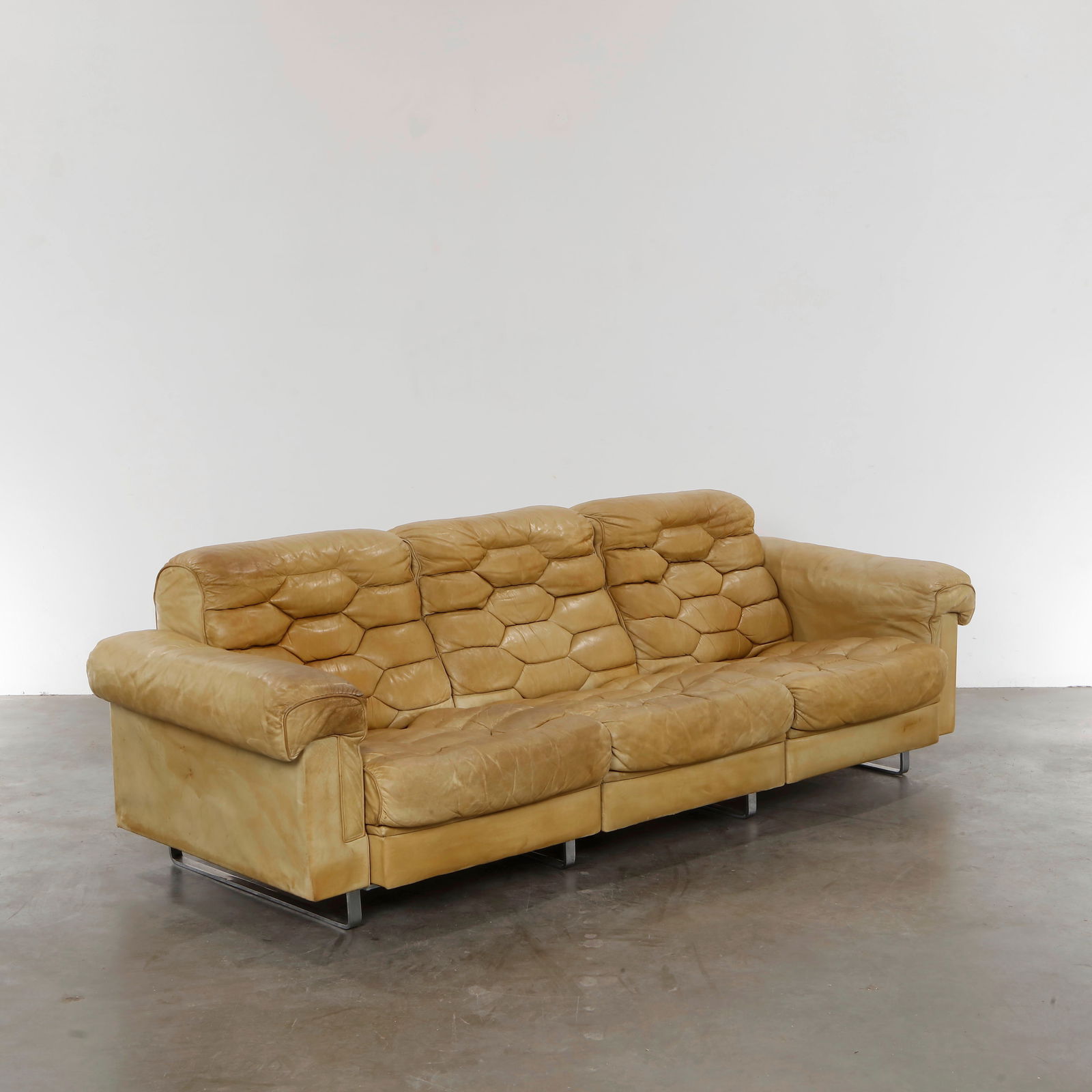 Robert Haussmann for De Sede, Model Ds-P 3-Seater Leather Sofa, 1970s: Iconic 1970s 3-seater by Robert Haussmann for De Sede. Quilted leather upholstery in a distinctive honeycomb pattern. Height: 29.5 in. Width: 91.5 in. Depth: 34 in. Seat Depth: 22 in. Seat Height: 16