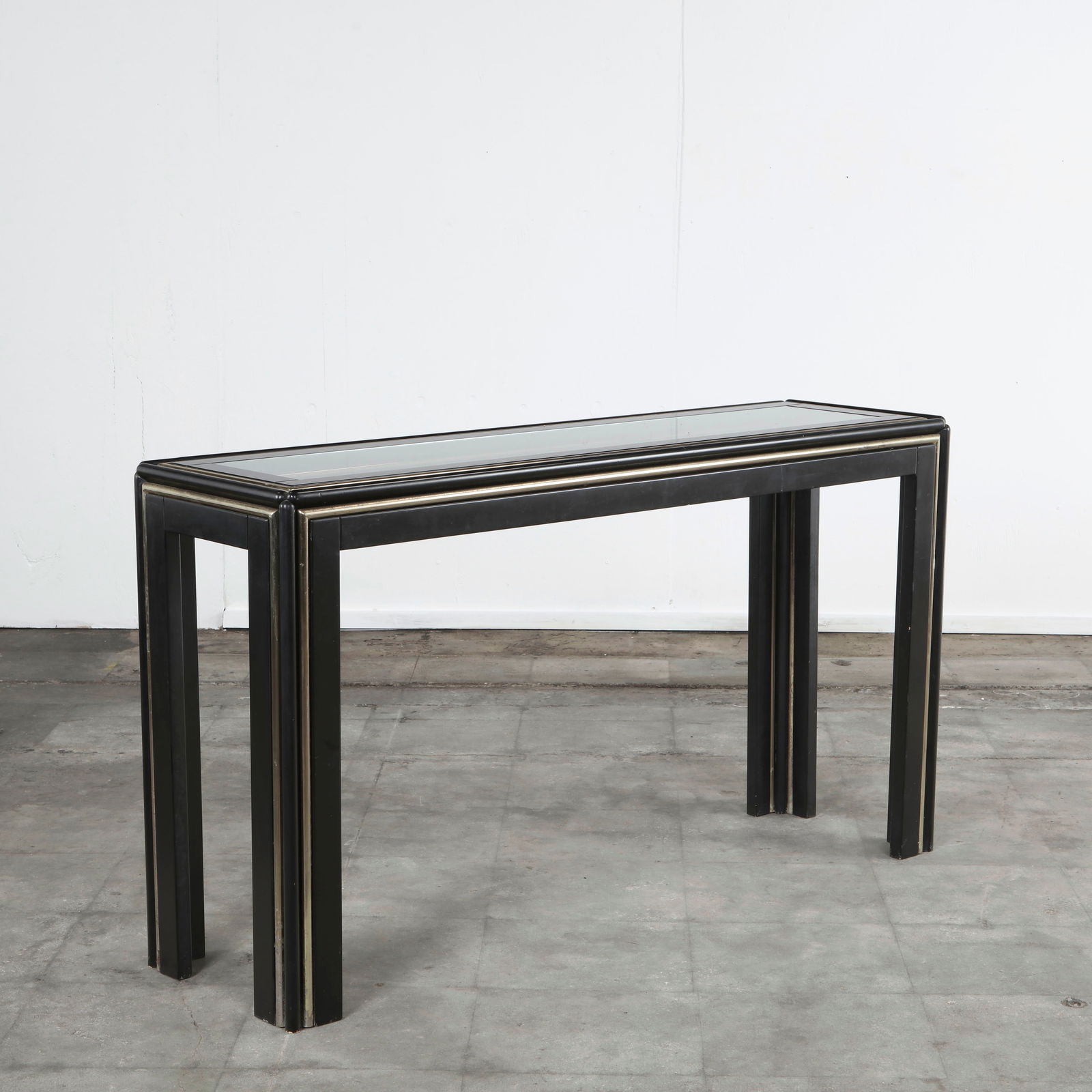 Black Lacquered Console Table with Brass Detailing, 1970s: Rectangular console table with a black lacquered frame, inset glass top, and brass accents. Its sleek design and luxurious finishes make it a refined addition to a hallway, living room, or entryway. H