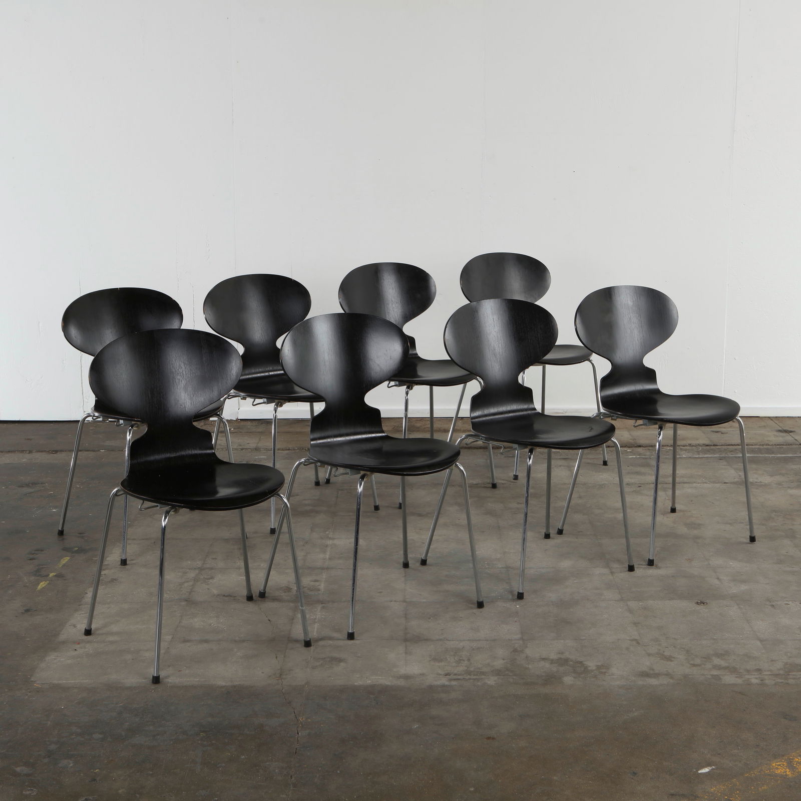 Arne Jacobsen for Fritz Hansen, Set of Eight Ant Dining Chairs, 1950s: Iconic Danish dining chairs with black lacquered bentwood seats on chrome legs, designed by Arne Jacobsen for Fritz Hansen. Height: 31 in. Width: 16.5 in. Depth: 17 in. Seat Depth: 15 in. Seat Height: