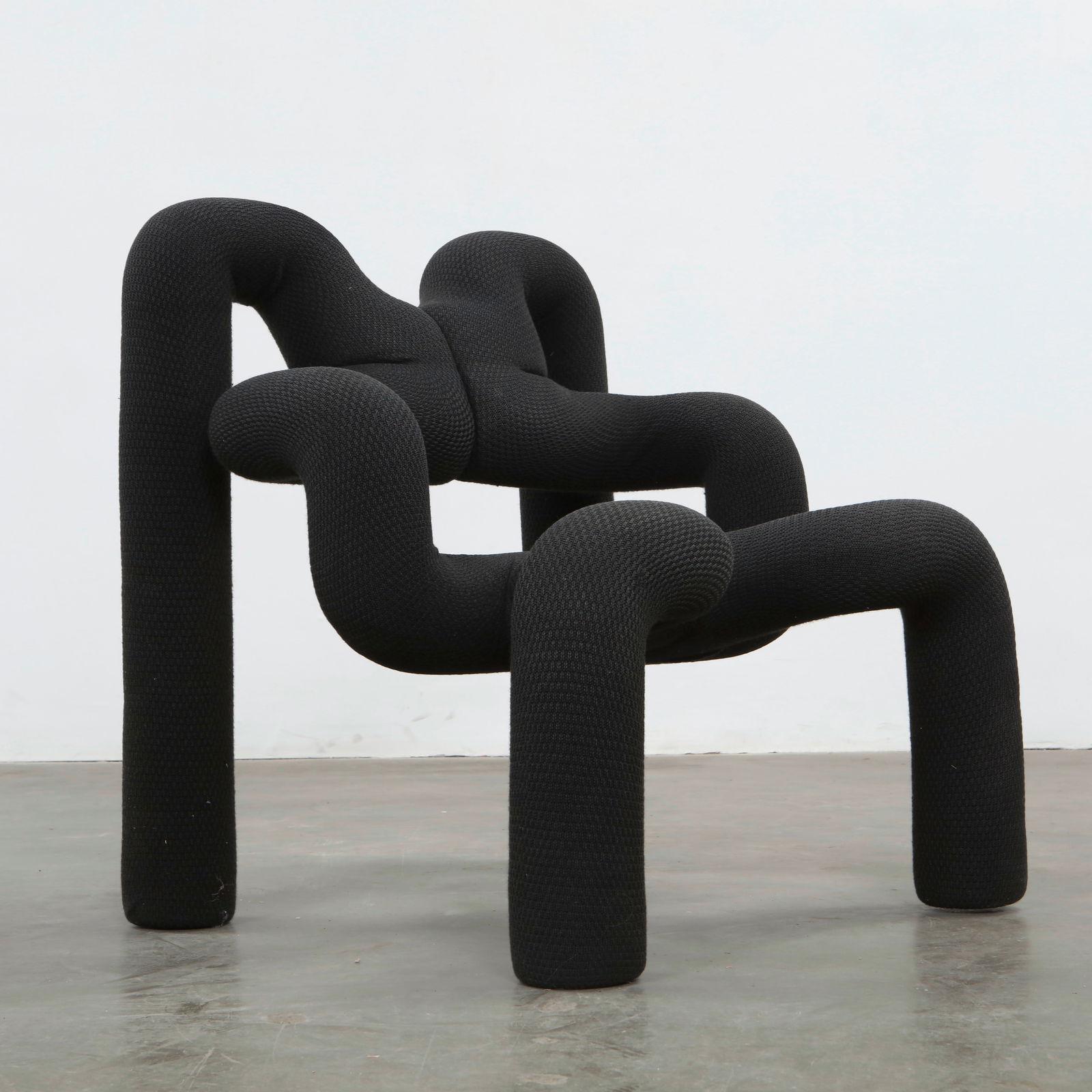 Terje Ekstrom, Ekstrem Chair, 1984: An icon of postmodern design, the Ekstrem chair features a bold sculptural form upholstered in black fabric. A statement of radical ergonomics and artistic expression from 1980s Norway. Height: 31 in.