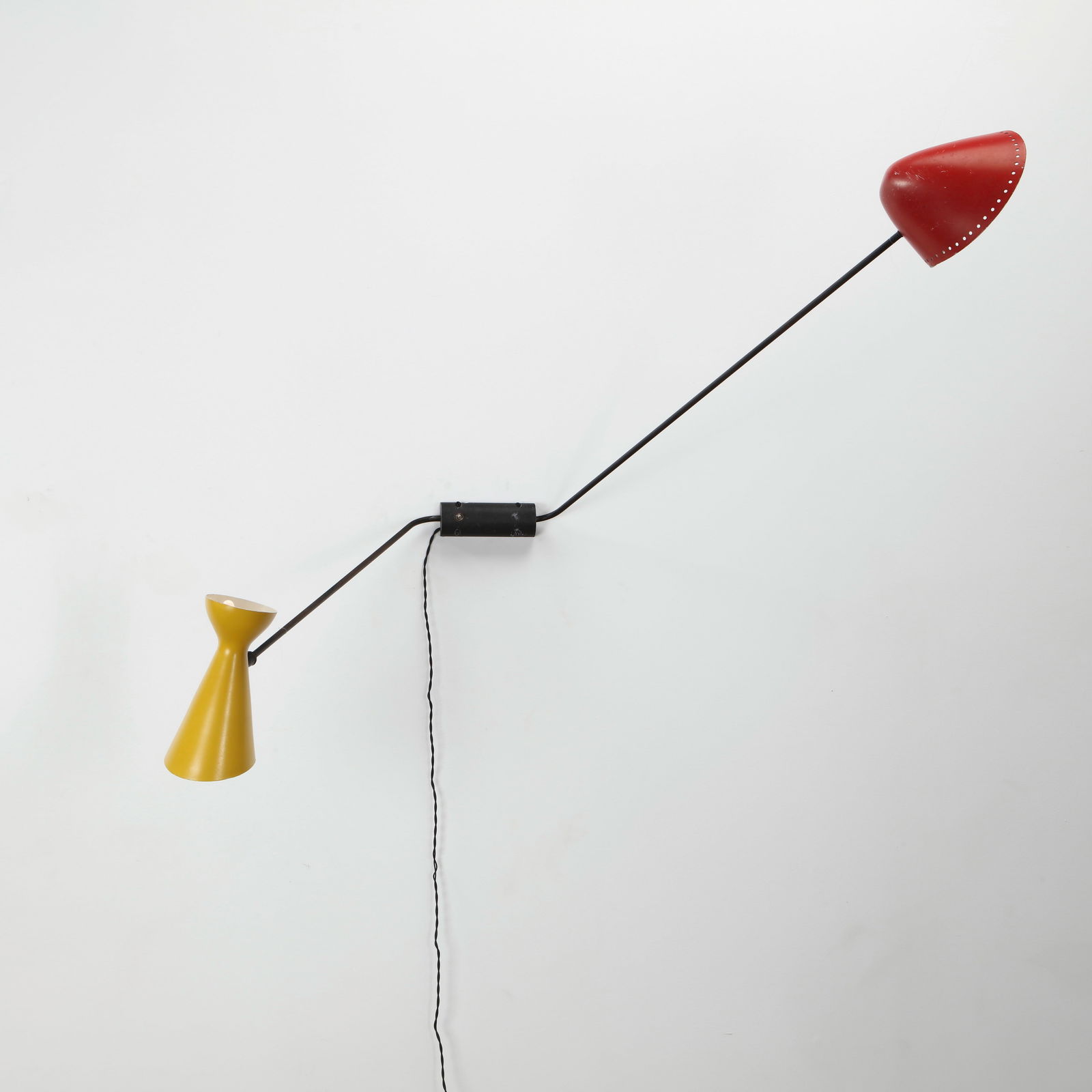 Double Arm Lamp attributed to Pierre Guariche for Disderot France, 1950: Double-arm wall lamp with adjustable metal shades and brass fittings, attributed to Guariche for Disderot. Red: Length: 44 in.Yellow: 27 in. Corde: 110 in. Basse: 6.5 in.