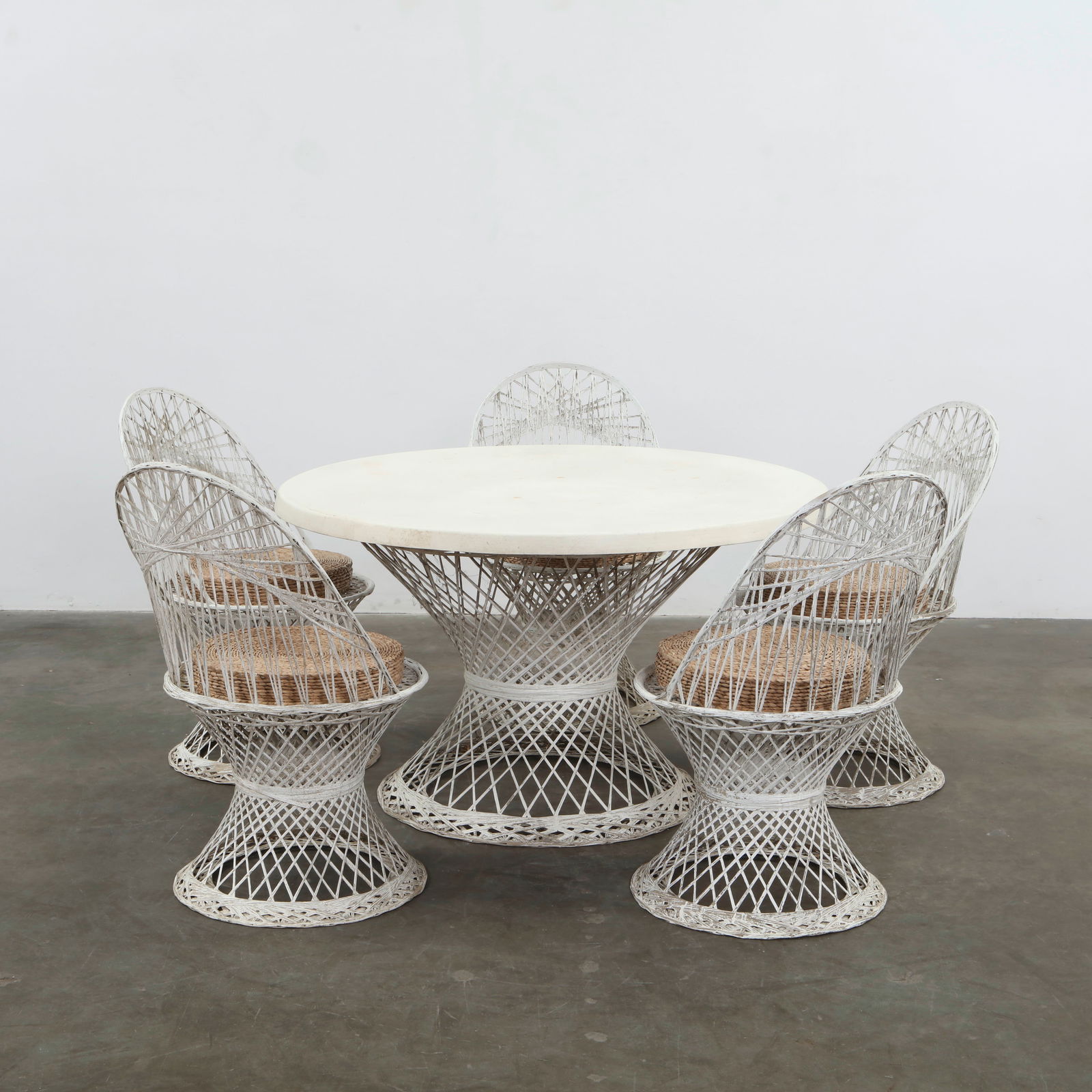 Russell Woodard, Fiberglass Patio Set, USA, 1950s: Elegant outdoor suite in molded fiberglass, comprising four sculptural chairs, one dining table. The open latticework and organic silhouettes capture the lightness and innovation of mid-century Americ
