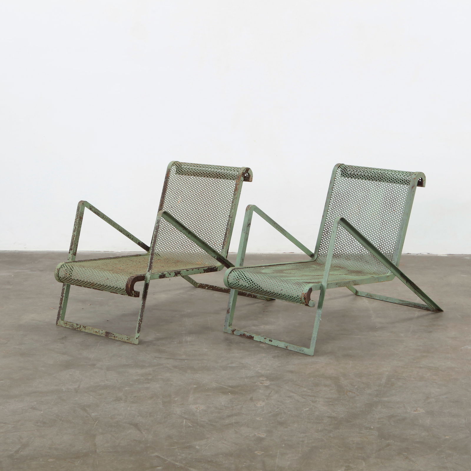 Pair of Perforated Metal Lounge Chairs attributed to Jean Royere, 1950s (1 of 17)