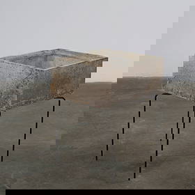 Willy Guhl, Square Planter on Metal Stand, 1960s: This planter features a geometric basin resting on slender black metal legs, characteristic of Guhl architectural garden forms. The weathered patina enhances its sculptural simplicity and timeless mod