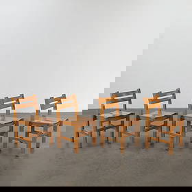 Charlotte Perriand for Les Arcs, Set of Four Pine Chairs, France, 1960s: Solid pine construction with curved backs and signature simplicity. Designed for the Les Arcs ski resort in Savoie. Height: 30.5 in. Width: 16.5 in. Depth: 18 in. Seat Depth: 16 in. Seat Height: 18 in