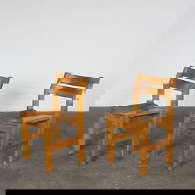 Charlotte Perriand, Pair of Pine Chairs for Les Arcs 1600, 1960s: Pair of solid pine chairs with clean, angular lines and slatted backs, emblematic of Les Arcs alpine design. Height: 30 in. Width: 16.8 in. Depth: 16 in. Seat Depth: 15 in. Seat Height: 18 in.