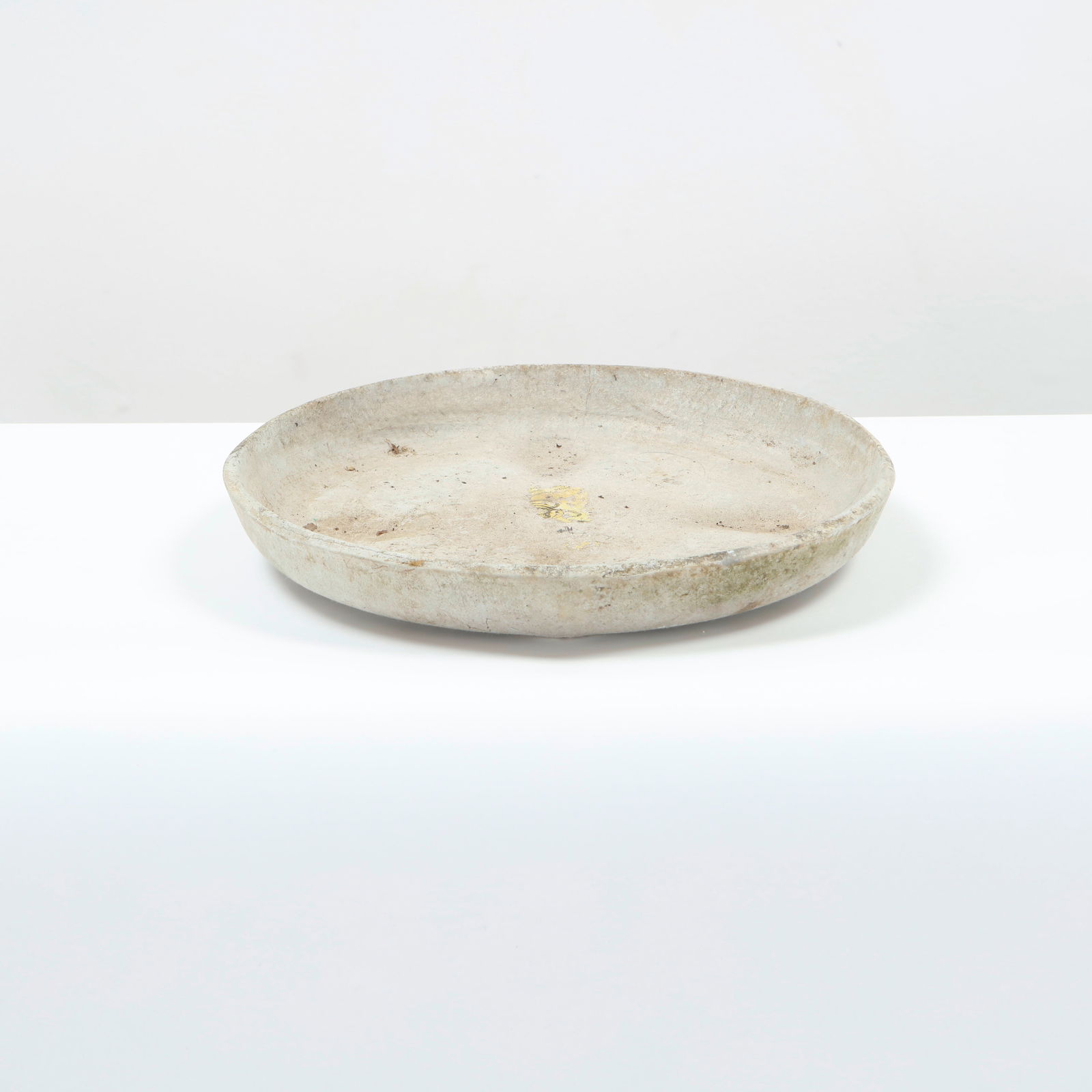 Willy Guhl, Small Round Tray in Fiber Cement, Switzerland, 1950s: Circular tray in patinated fiber cement, displaying the tactile minimalism central to Guhl aesthetic. Once utilitarian, now reimagined as a timeless decorative accent for interior or garden use. Diame