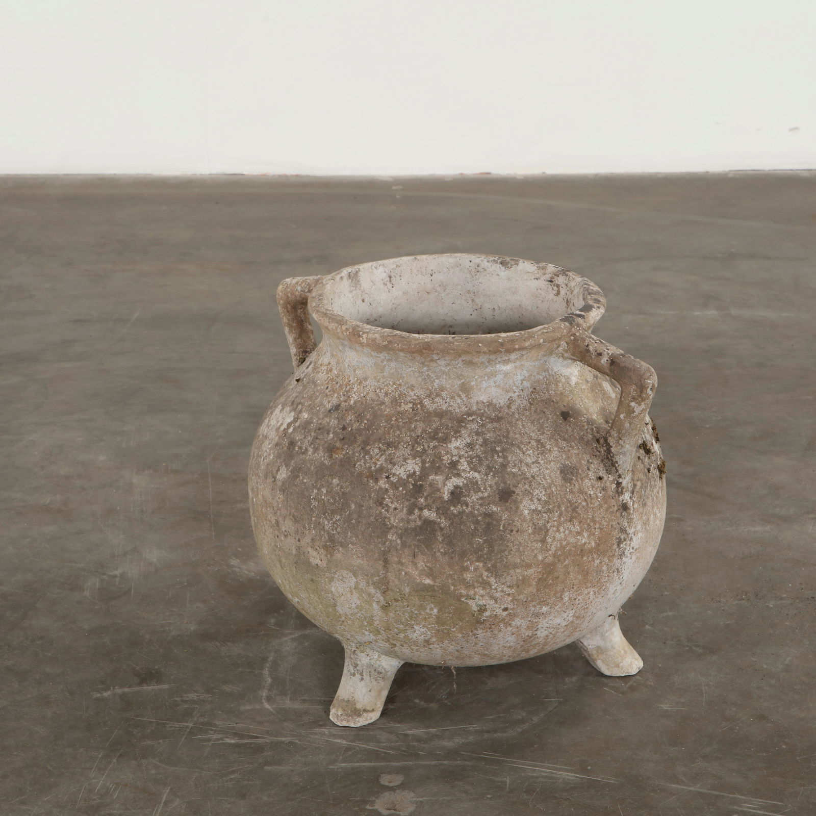 Willy Guhl, Cauldron Planter, 1960s: The iconic rounded form of the marmite planter is cast in cement, featuring simple integrated handles and the elegantly tapered base typical of Guhl. Its weathered exterior enriches the sculptural qua