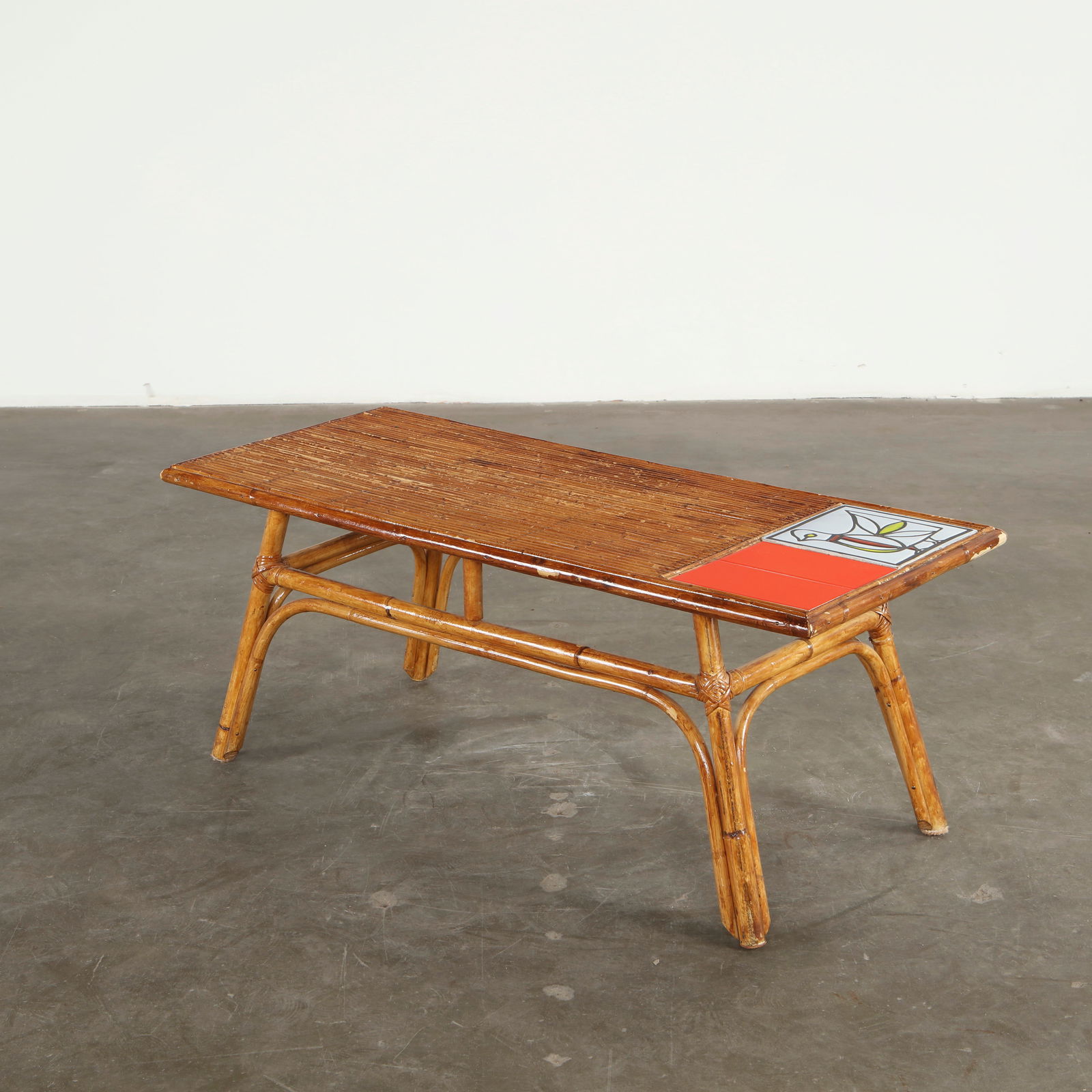 Audoux Minet for Roger Capron, Bamboo and Ceramic Coffee Table, 1950s: Uniting slender bamboo framing with vivid hand glazed ceramic tiles, this table expresses the natural material vocabulary of Audoux Minet. The contrast between woven warmth and polished ceramic provid
